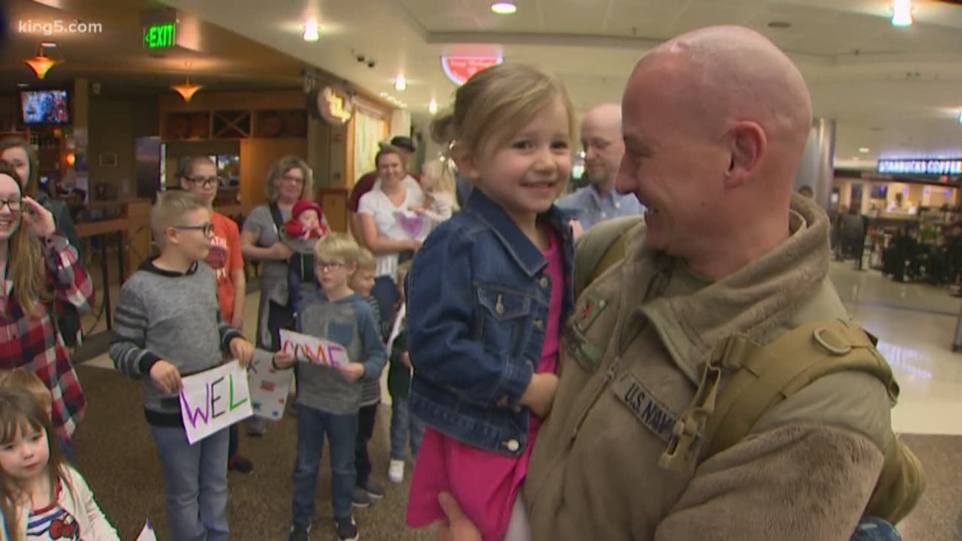 A crowd gathered to welcome home a reservist after 233 days deployed. KING 5's Dustin Gagne was there for the reunion at Sea-Tac Airport.
