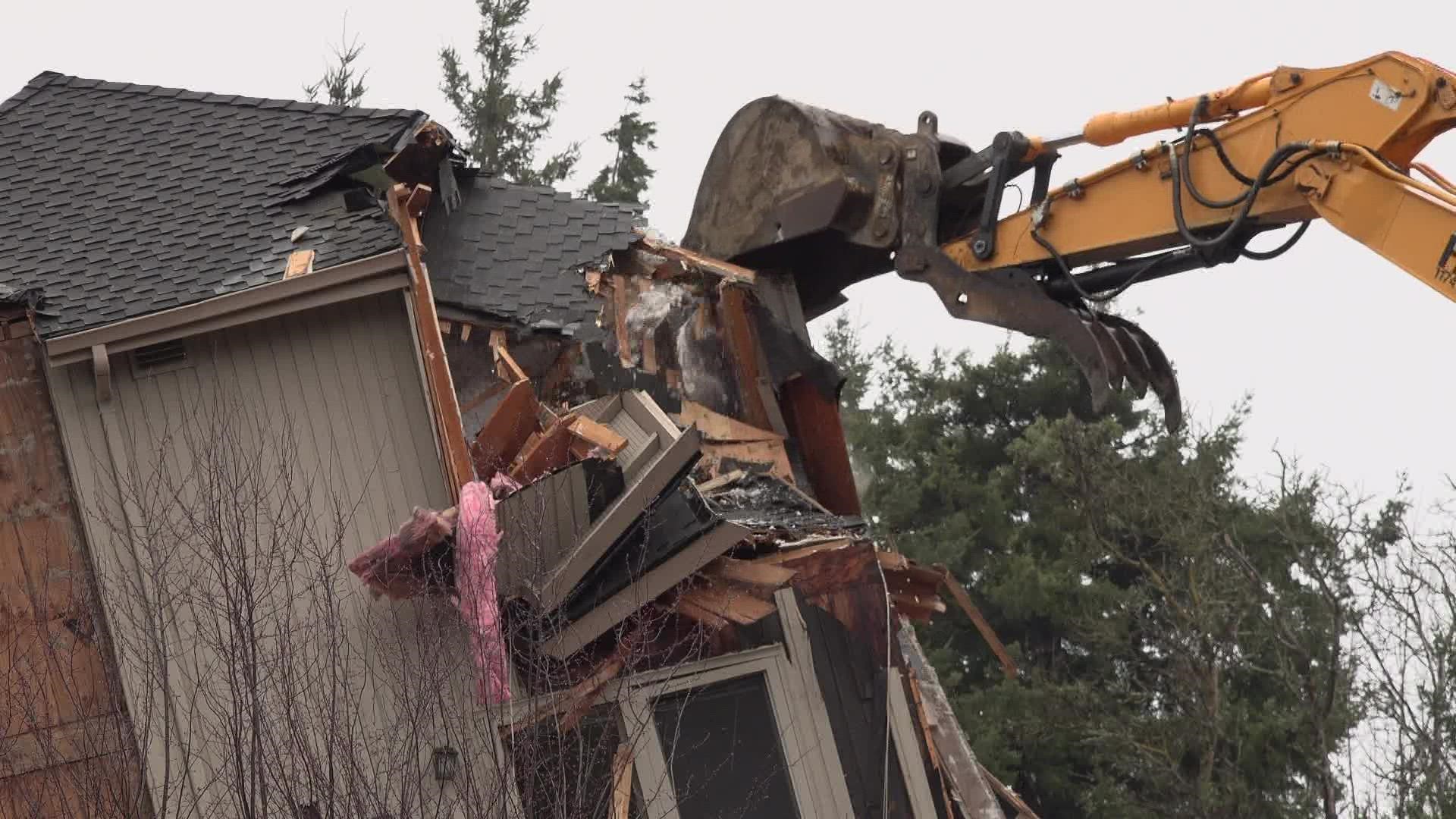 The house had been sitting at an angle since Jan. 17, when it was pushed off its foundation. The City of Bellevue says the cause is under investigation.