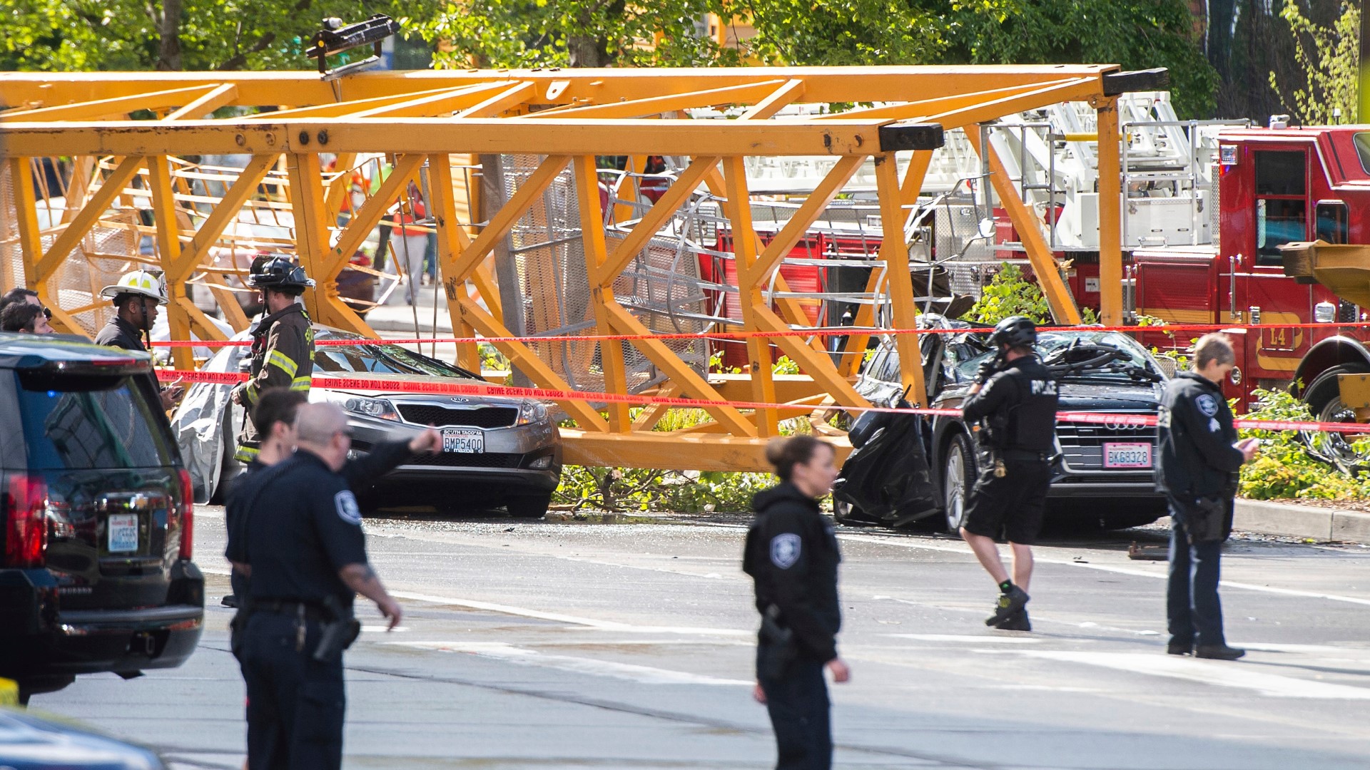 A crane fell onto cars in one of downtown Seattle's busiest thoroughfares.