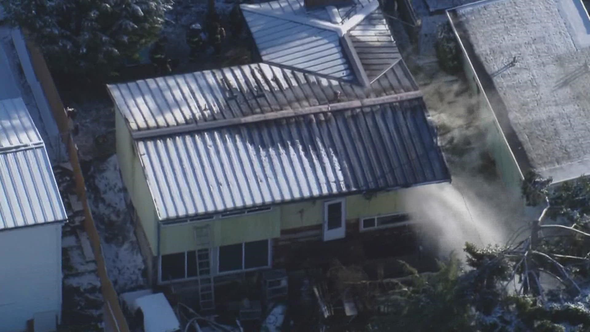 A 70-year-old woman died at the scene, according to the Seattle Fire Department.