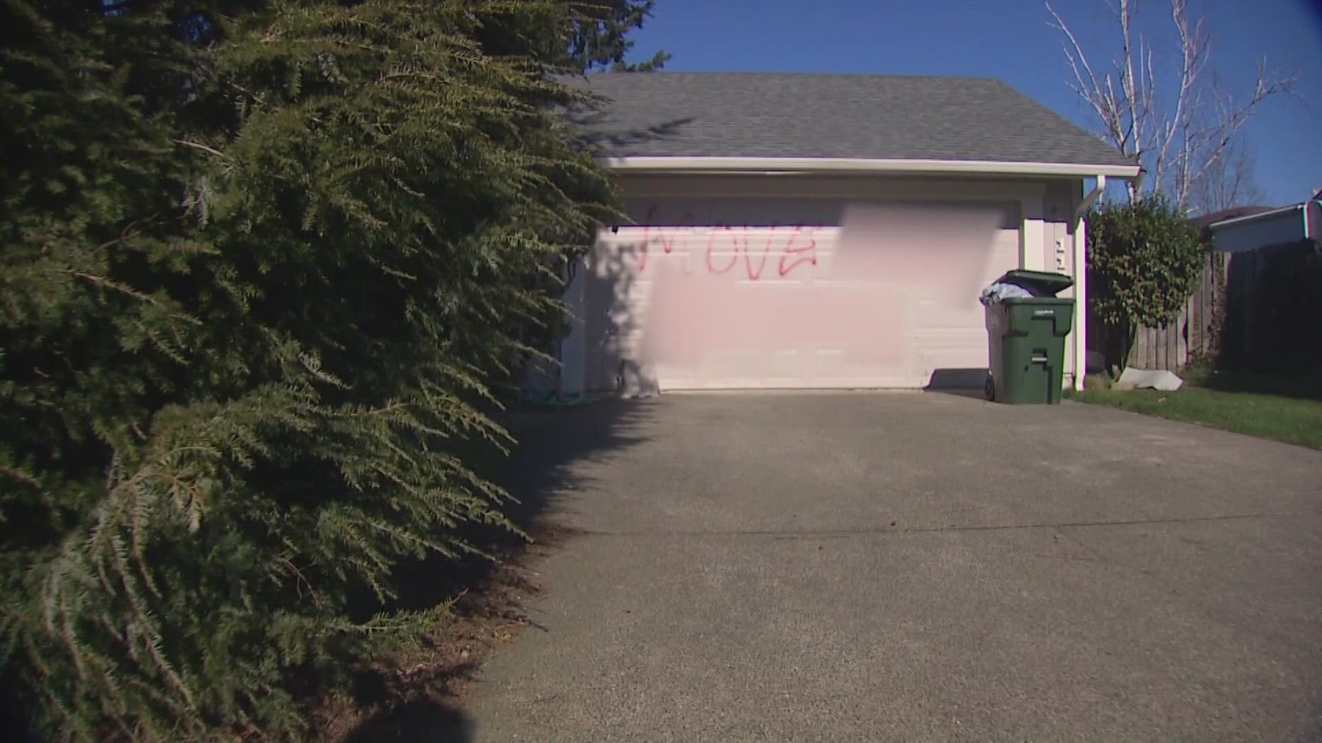 The Pierce County Sheriff's Office is investigating who spray-painted the n-word and a demand that the resident moves out onto a garage in Parkland.