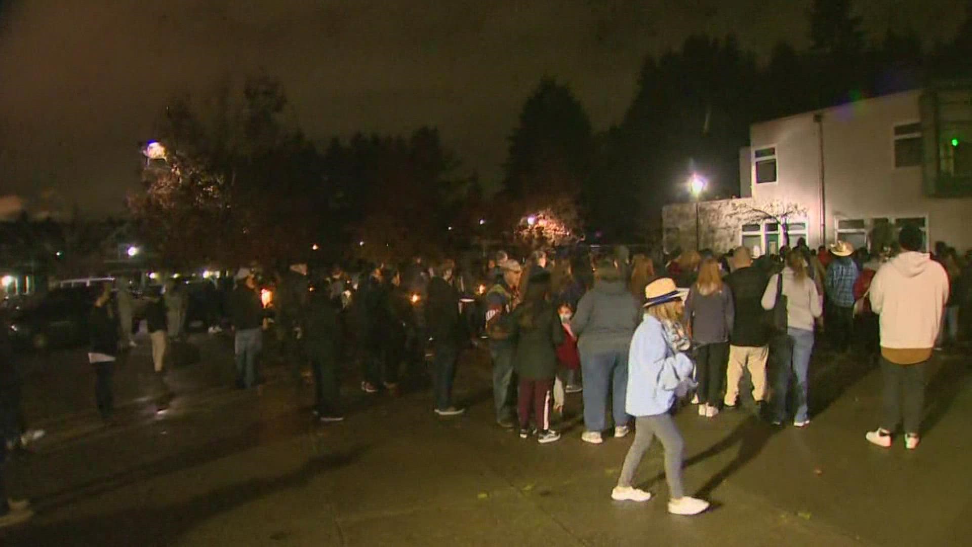 The vigil drew dozens of people to Lister Elementary School, where the remembrance was held.
