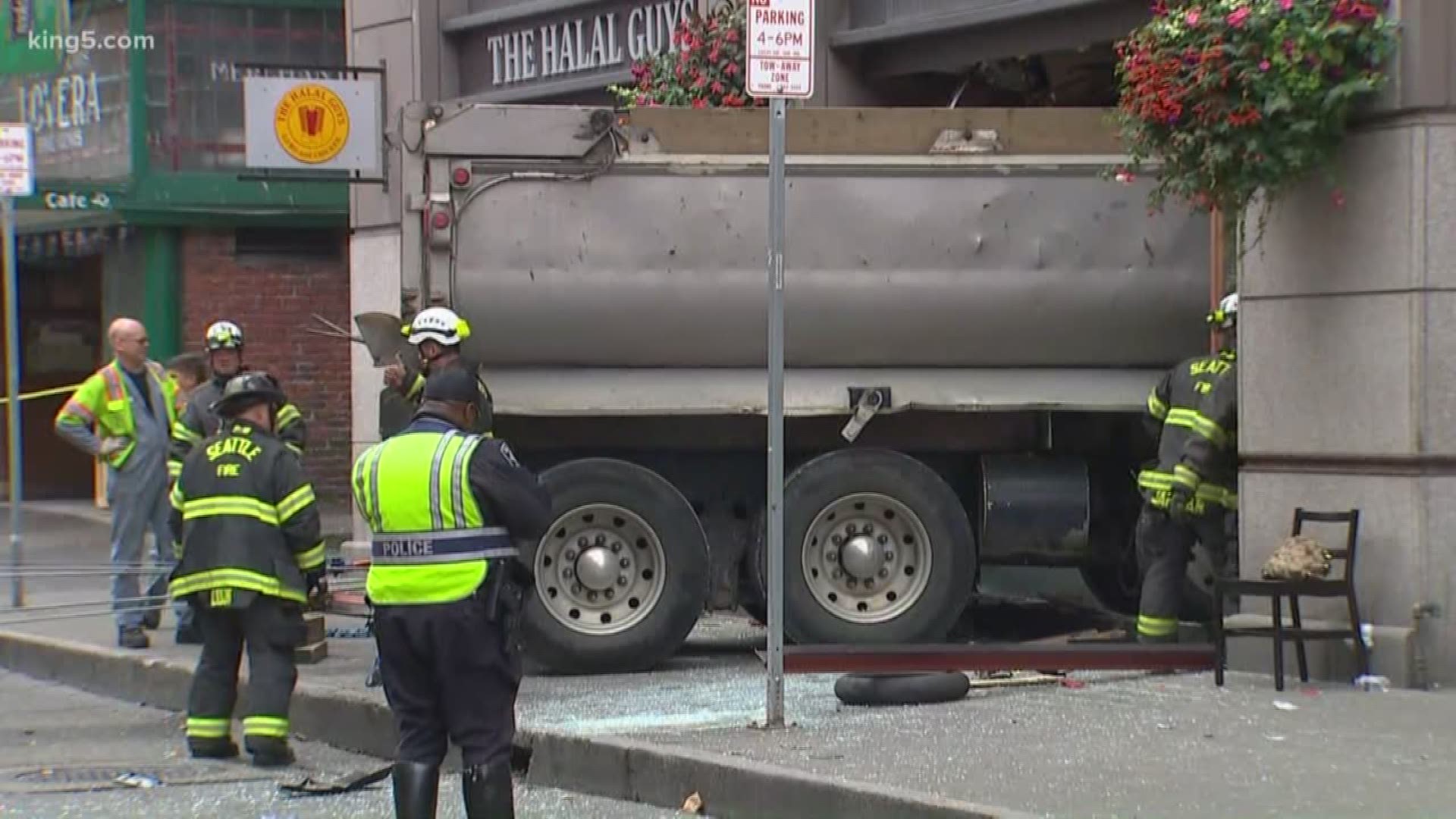 Newly released 911 audio from when a dump truck crashed into a Subway restaurant in Pioneer Square sheds light on how good samaritans rushed in to help.