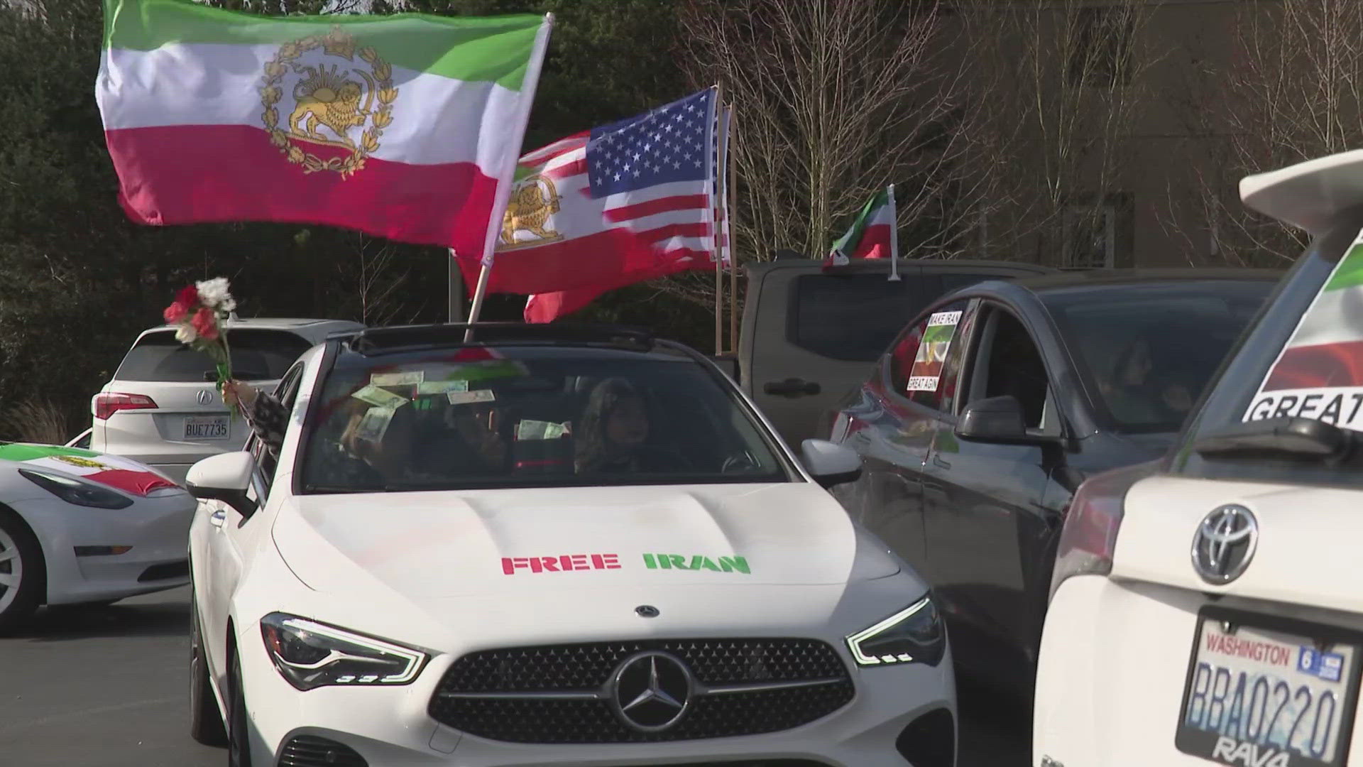 More than 300 vehicles flying Iranian, Israeli and American flags convoyed along I-5 and I-405 on Saturday afternoon.