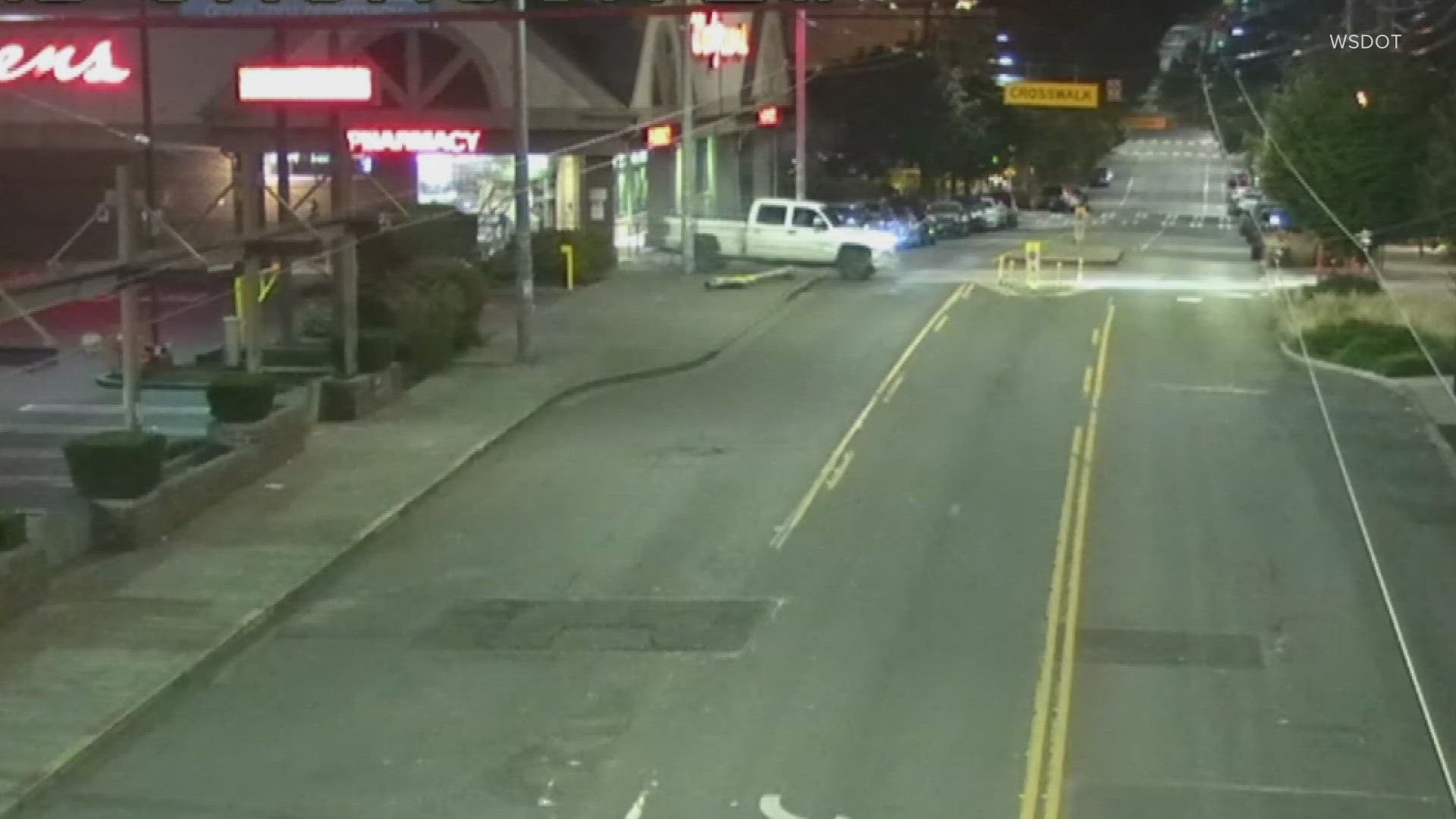 Surveillance video shows a person attempting to back a white truck into the Walgreens at 23rd and Jackson in south Seattle