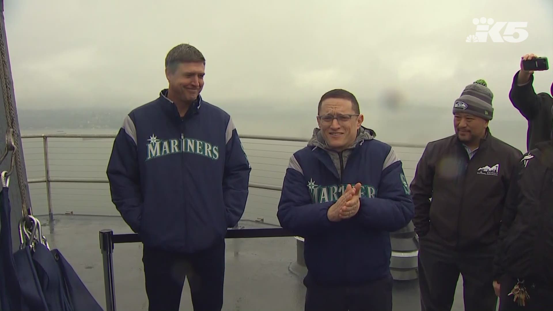 Dan Wilson, Edgar Martinez's former teammate, raises the 11 flag on the Space Needle after Martinez made it into the Baseball Hall of Fame.