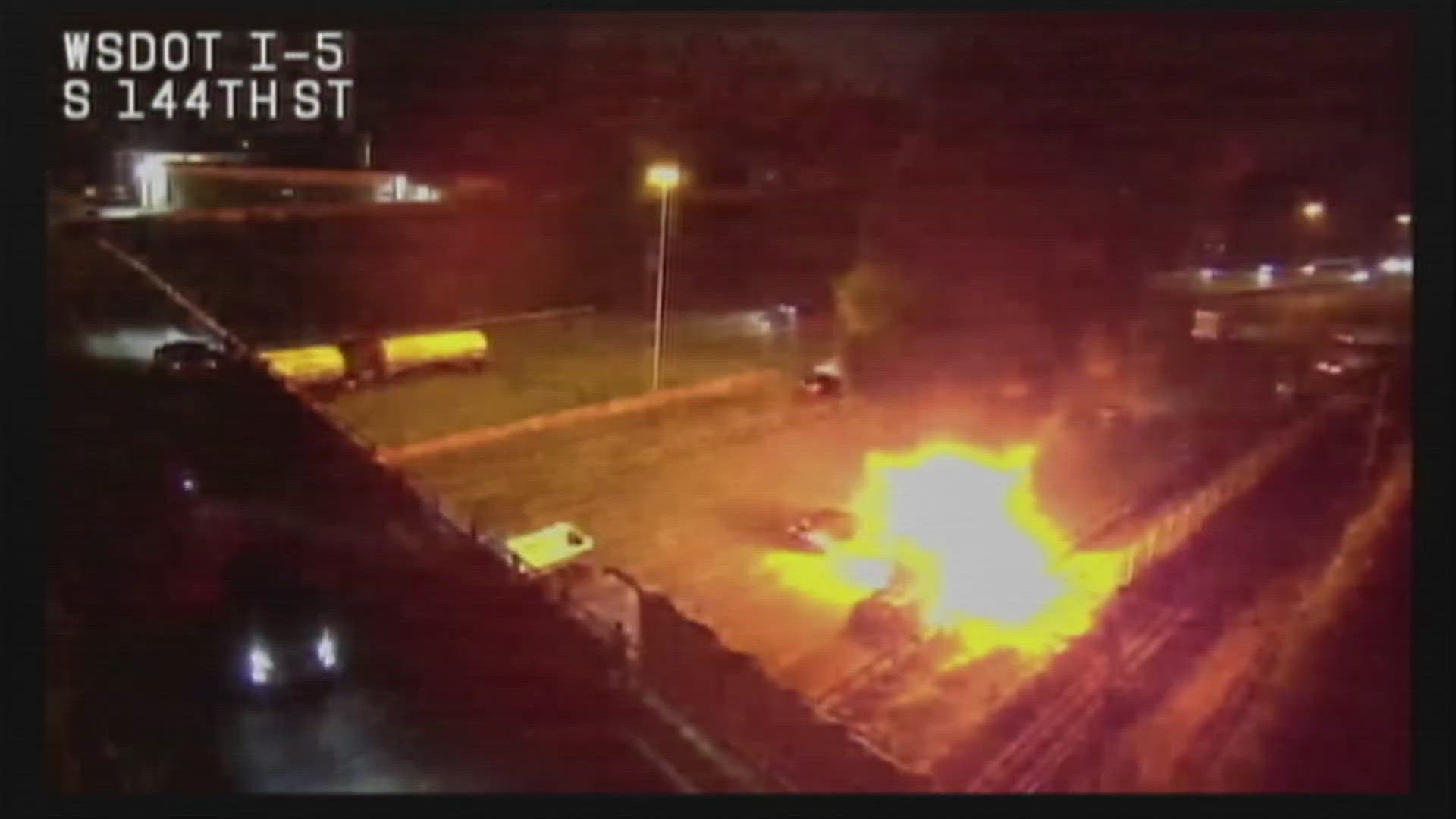 A semi-truck burst into flames and even a small explosion can seen on a traffic camera over I-5 in Tukwila Tuesday night