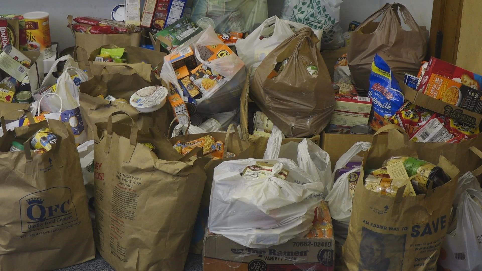 Donors can place items in the collection bin of their choice. One says “dinner” and the other says “pardon.” The items will be donated to a local food bank.