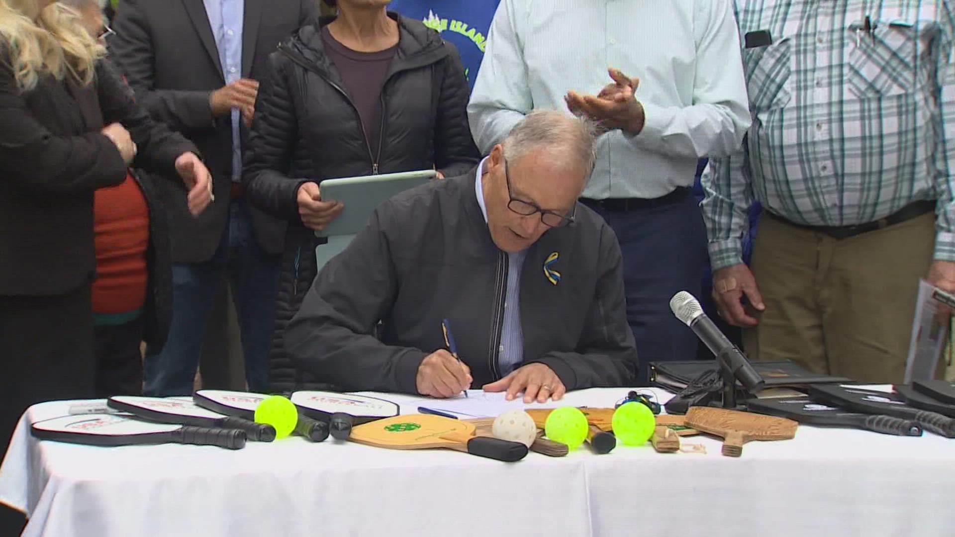 Gov. Jay Inslee signed the bill at the birthplace of the sport: Bainbridge Island.