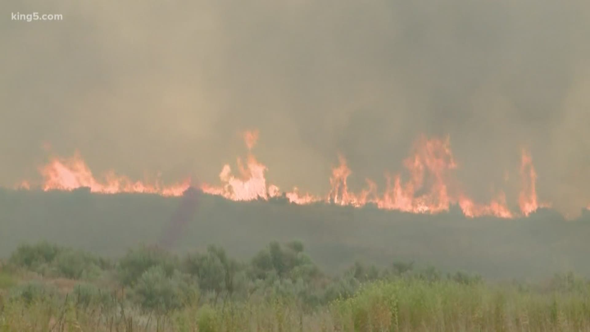 By air and by land, fire crews are trying to contain the wildfire burning in Grant County.  KING 5's Sebastian Robertson spent the day with firefighters and brings us the latest.