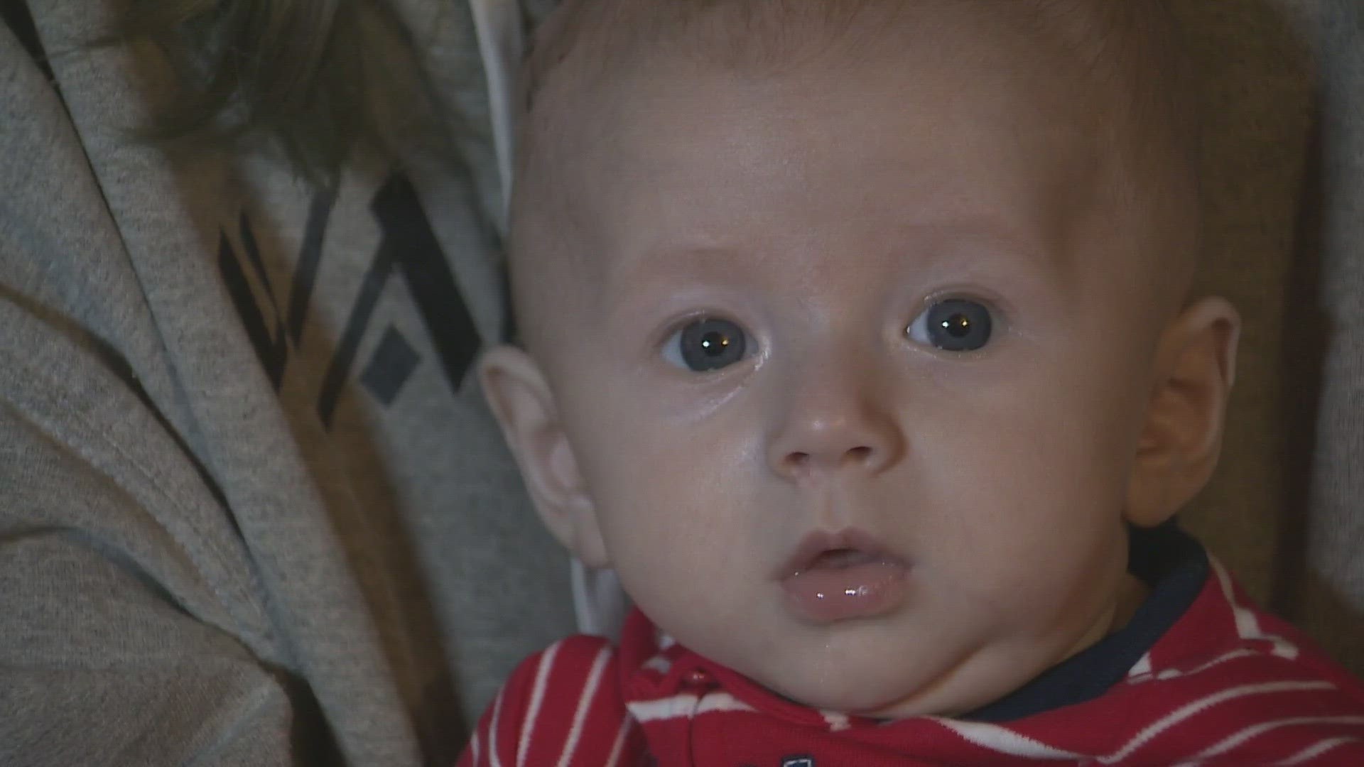 A three-month-old grazed with a stray bullet in the head and arm last week is back home recovering.