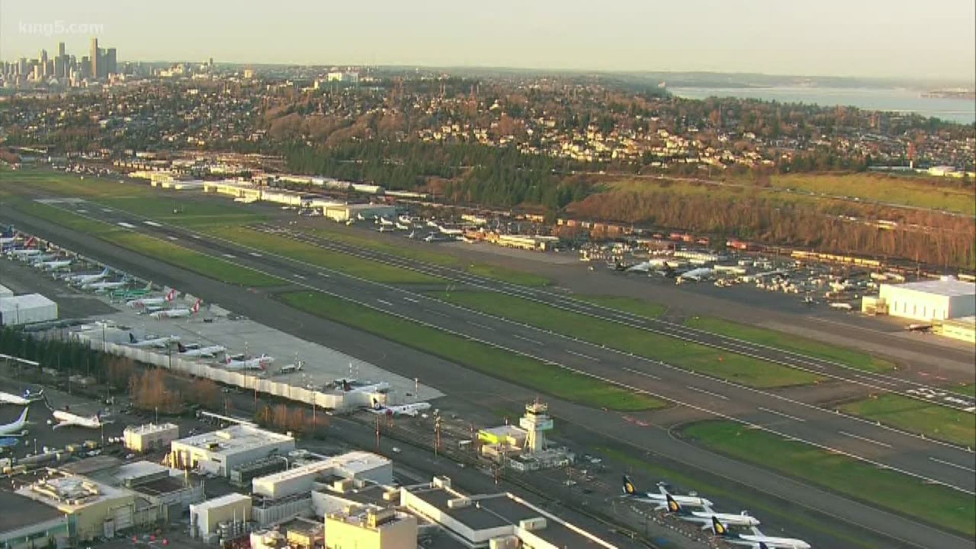 The Justice Department said contractors at Boeing Field stopped working with ICE after a King County executive order.