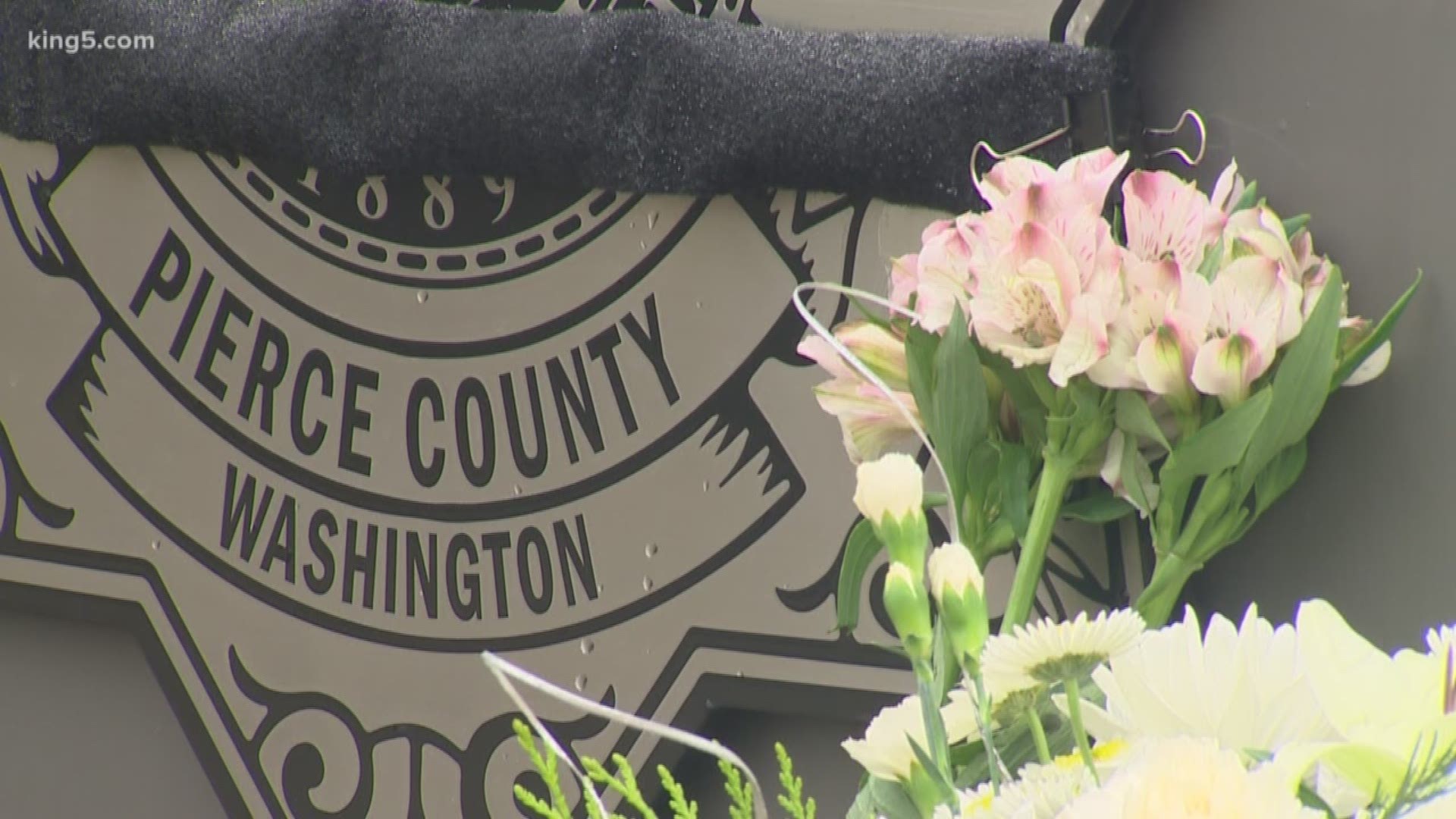 Pierce County Deputy Cooper Dyson died while driving to aid his fellow deputies, who were being assaulted by a suspect who was reportedly trying to access a firearm.