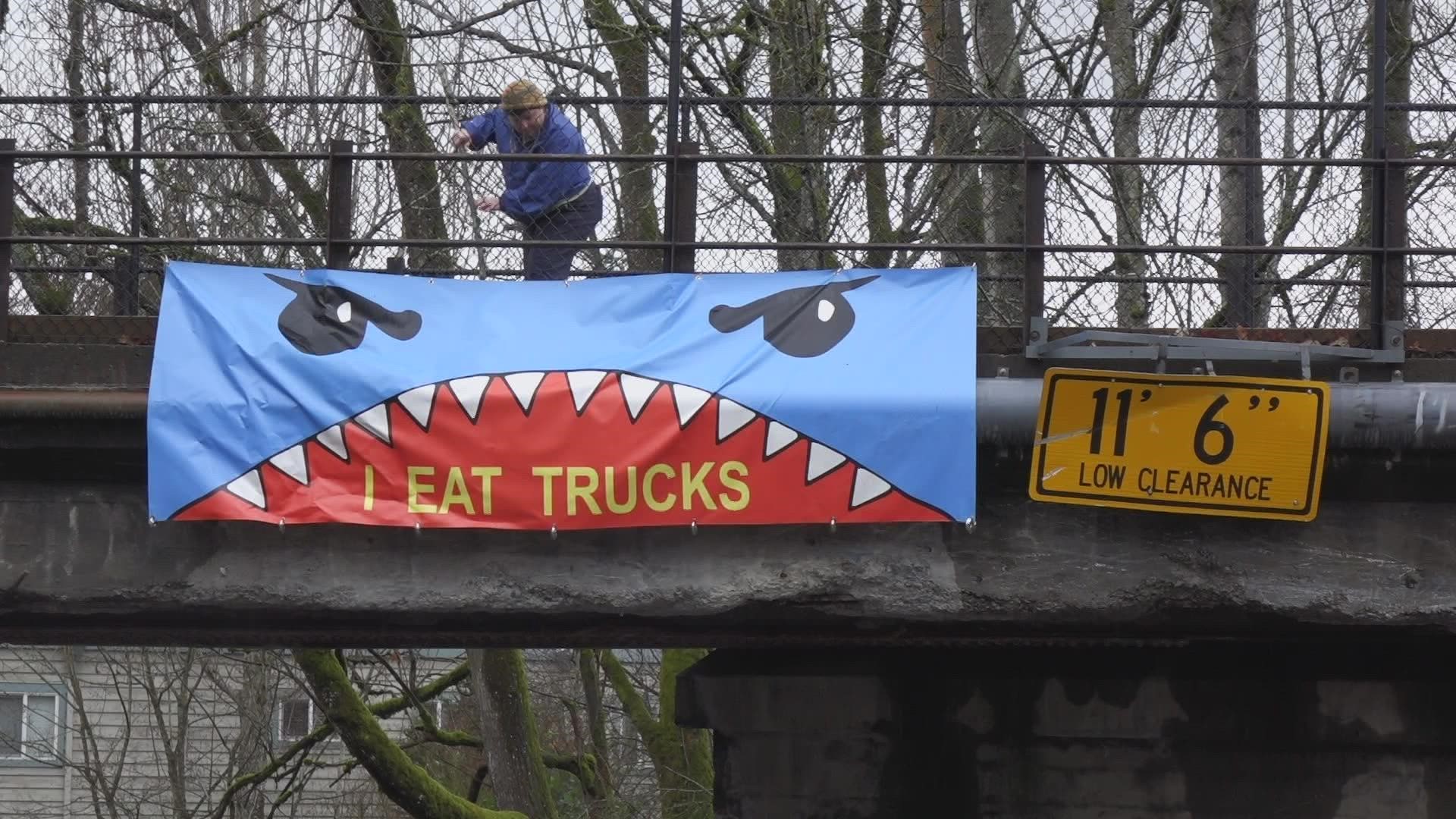 Residents took to creating their own signs warning trucks of the historic bridge's unusually low clearance.