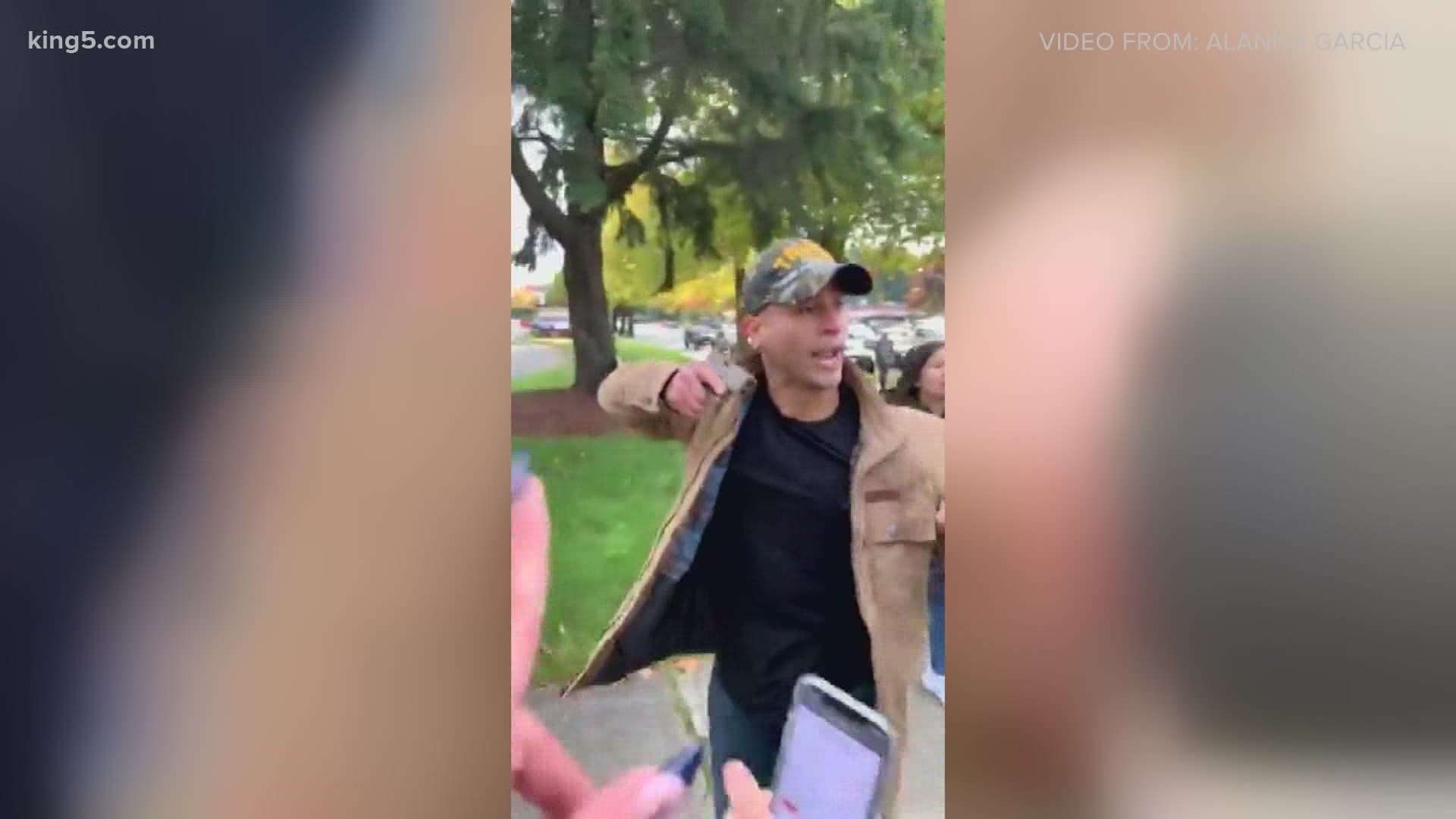 A man was seen on camera pointing a gun at a group of people during a political demonstration in Woodinville over the weekend.