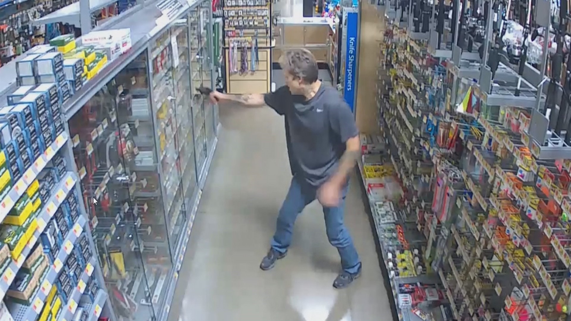 Surveillance shows gunman shoot ammo case at Tumwater Walmart