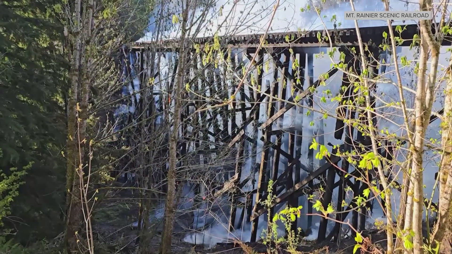 A fire destroyed a wooden train trestle on a historic Washington railroad that was under construction. 
