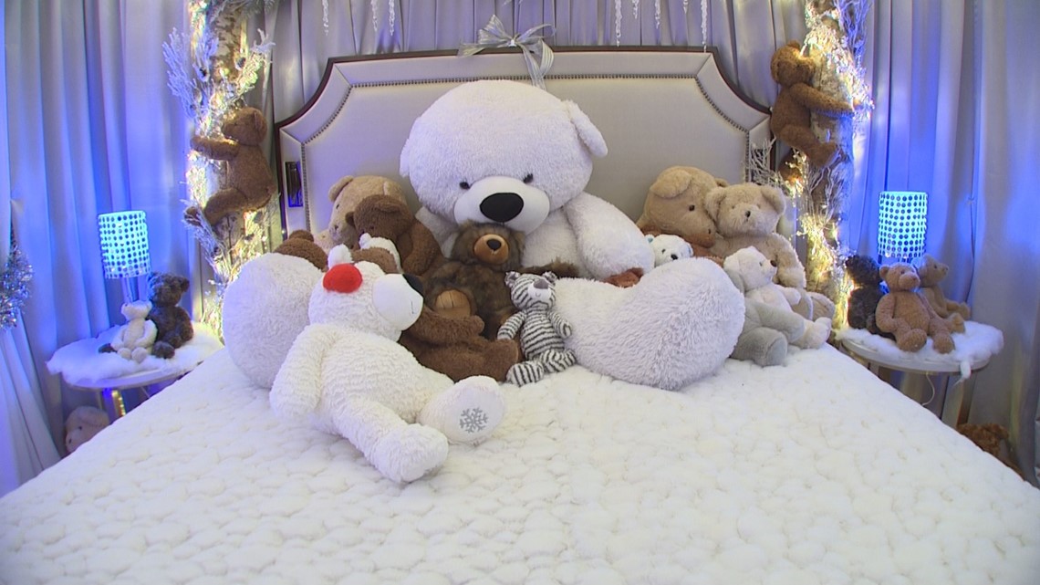 bed full of teddy bears