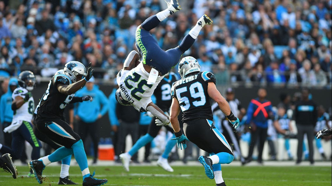 Running back Chris Carson of the Seattle Seahawks runs a pass