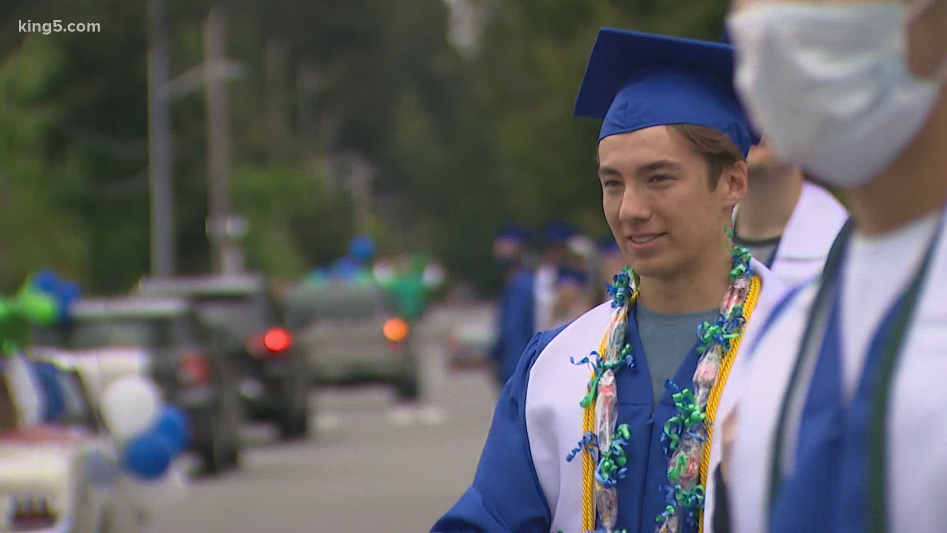 Shorewood High School seniors wore their caps and gowns for a socially distant ceremony to mark the end of high school