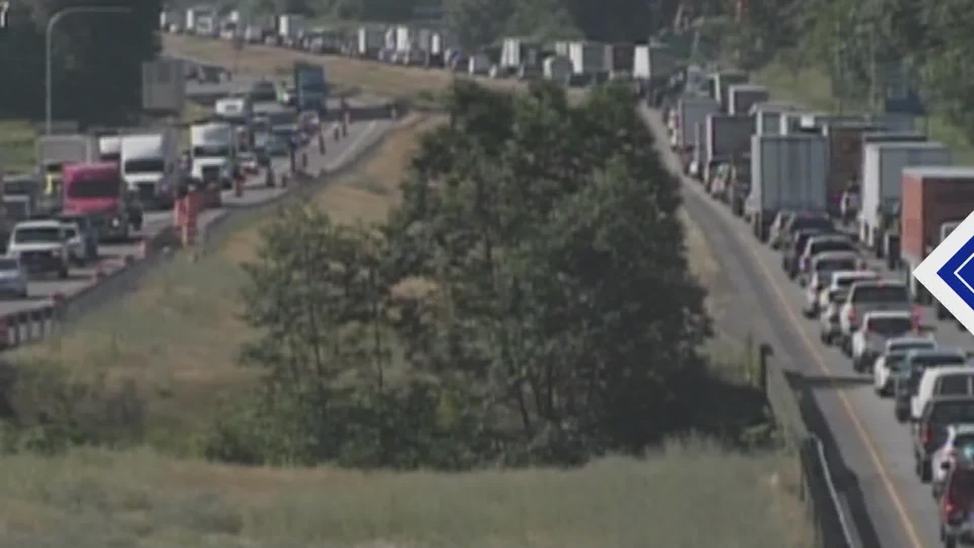 The rollover initially blocked all southbound lanes, causing a four-mile backup approaching the SR 410 interchange.
