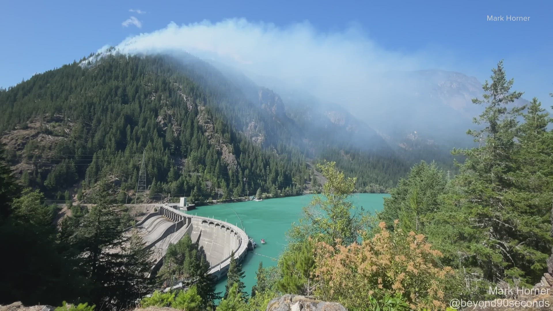 Seattle City Light says power-generating dams are safe for now, but it is monitoring the fire near the Skagit Hydroelectric Project closely.