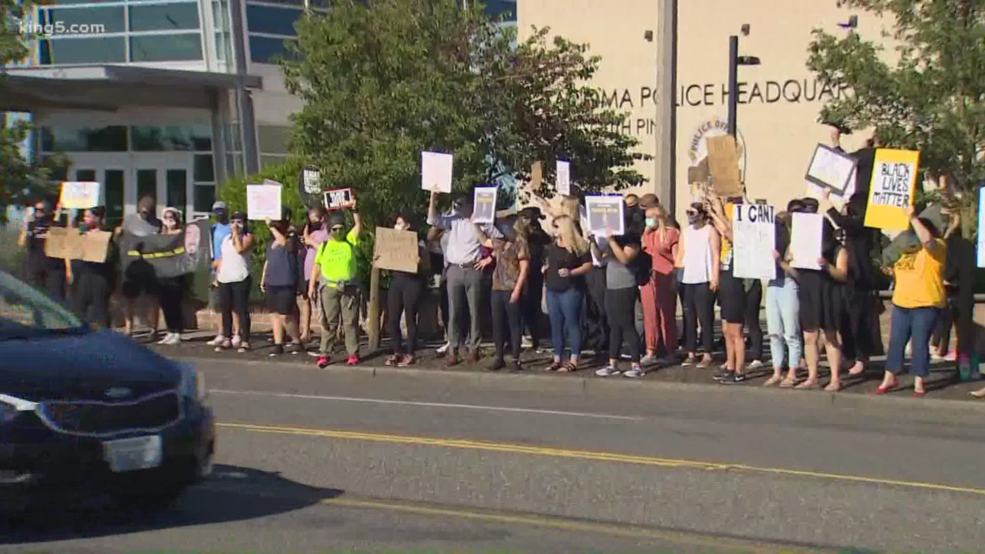 Protesters gathered at the Tacoma Police Department to demand the firing of four officers who are on leave after Ellis was killed during an arrest.