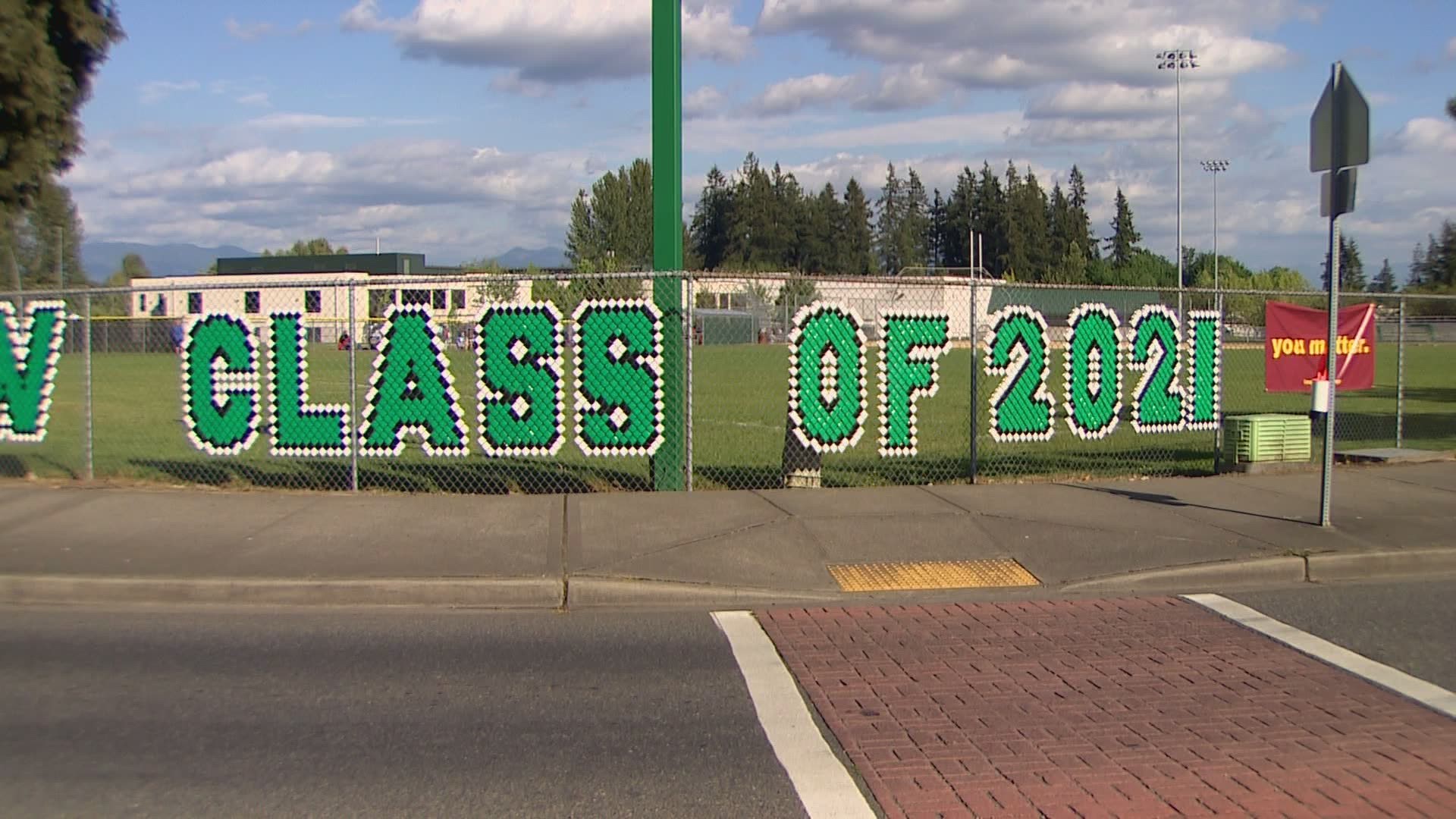 Under current guidelines, students would only get two tickets each for an in-person ceremony, which is why the district opted for a drive-thru graduation instead.