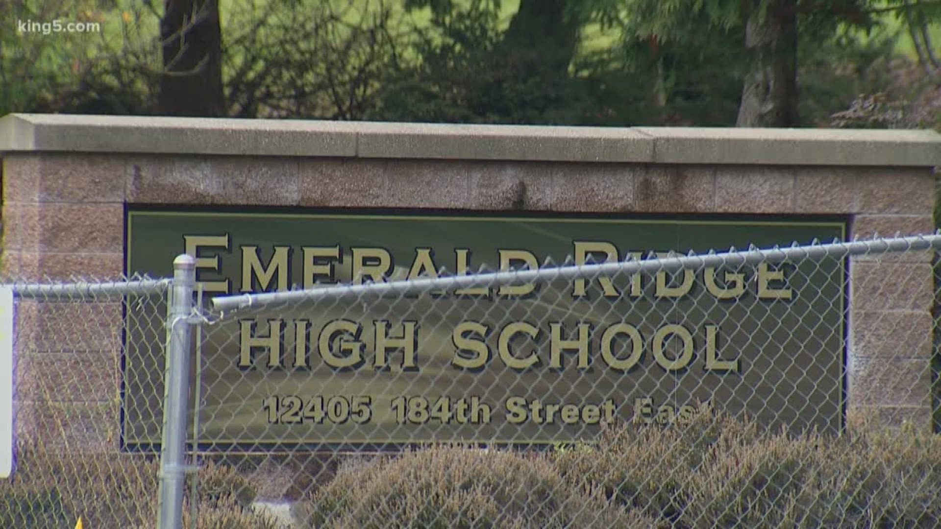 A teacher at Emerald Ridge High School is accused of threatening to shoot students during a conversation with a caseworker.