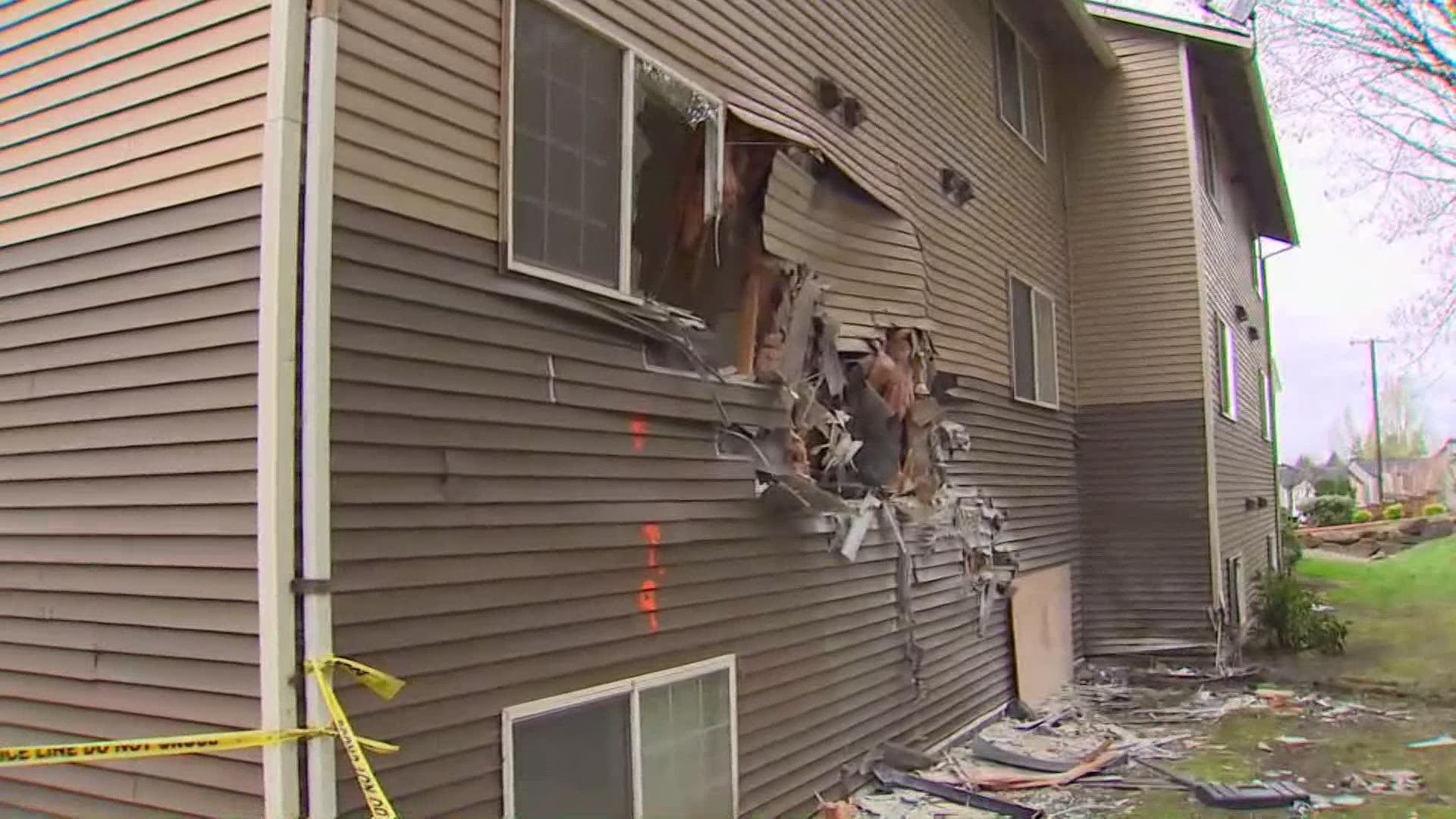 Six people and two dogs were in a vehicle that lost control and crashed into the second floor of an apartment building in Kent.