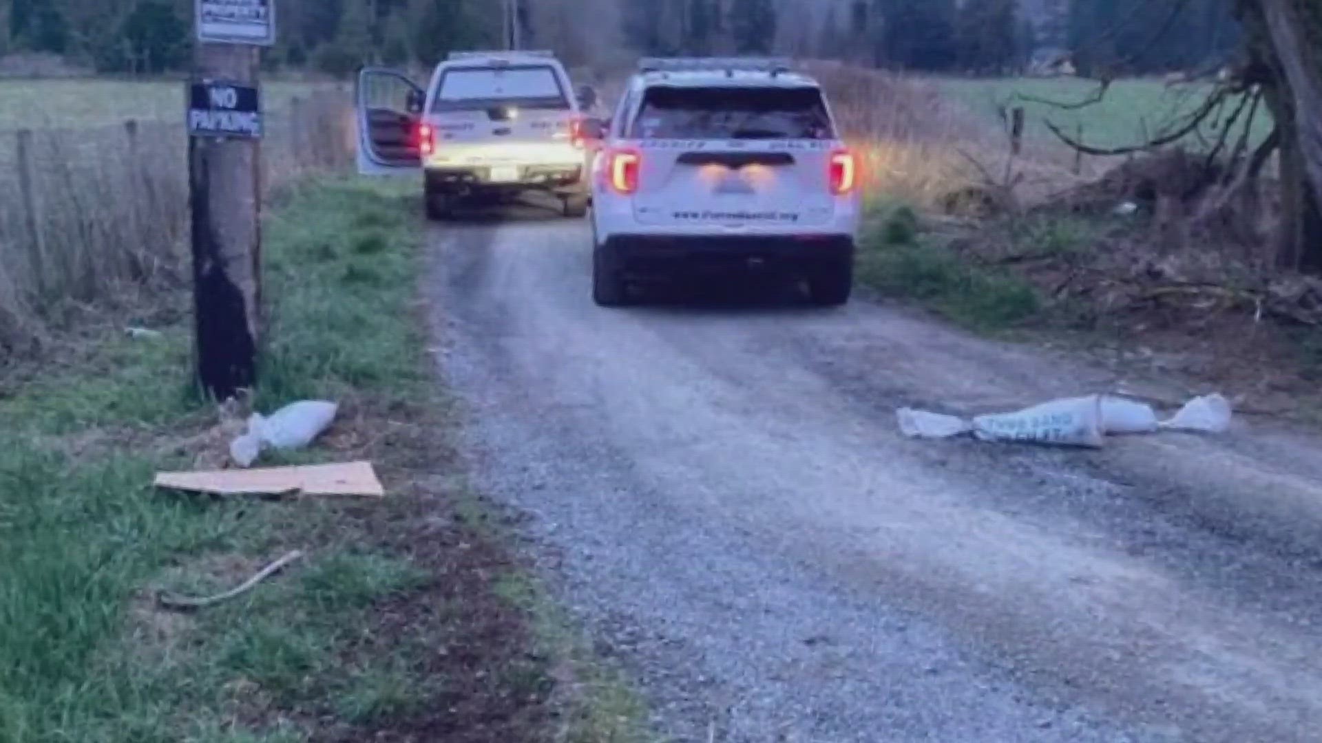 A woman got out of her car to move a sandbag that was left in the road when the suspect ran out and put a bag over her head. She was able to fight the suspect off.