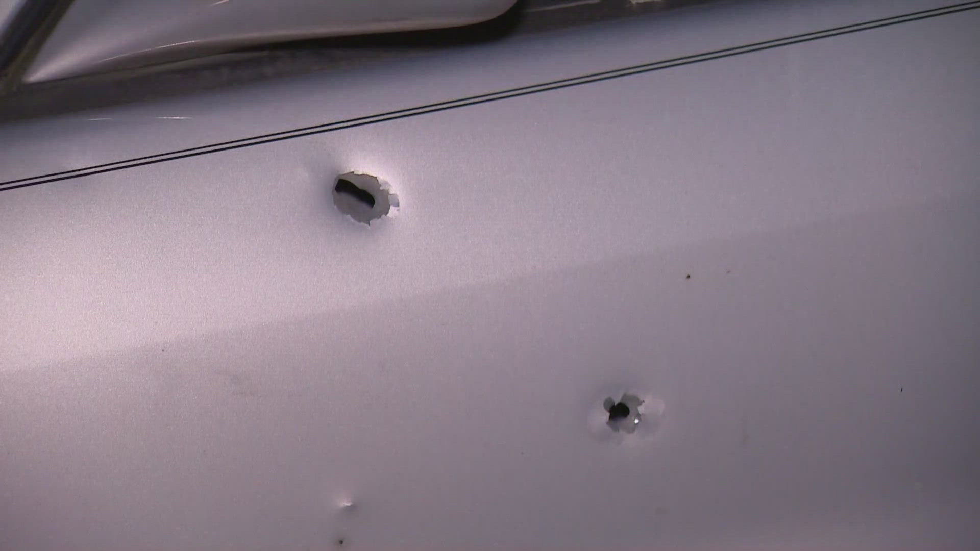 A man who lives nearby said he was woken up by the shooting, and police later notified him that there were bullet holes in his car.