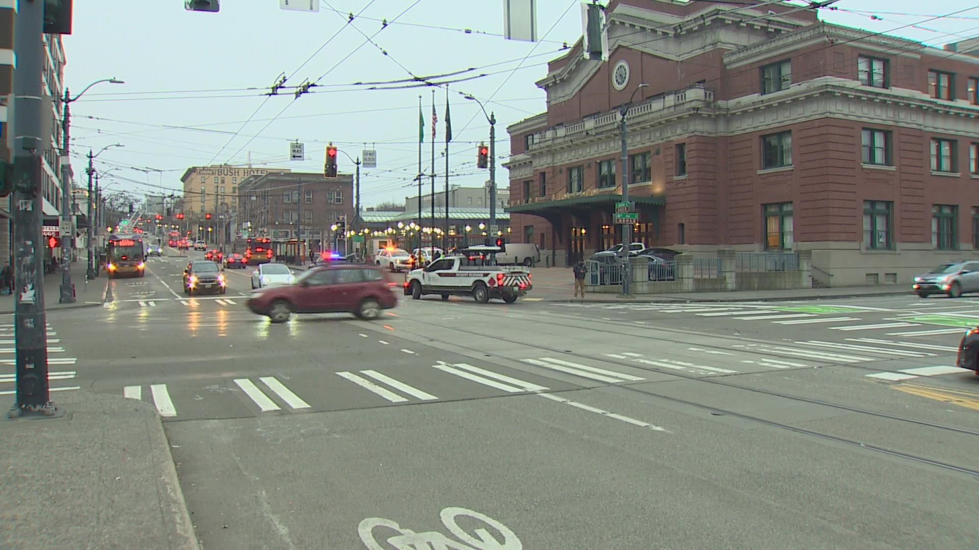 A man and a 10-year-old boy are in stable condition after being struck by a car near 4th and Jackson in Seattle
