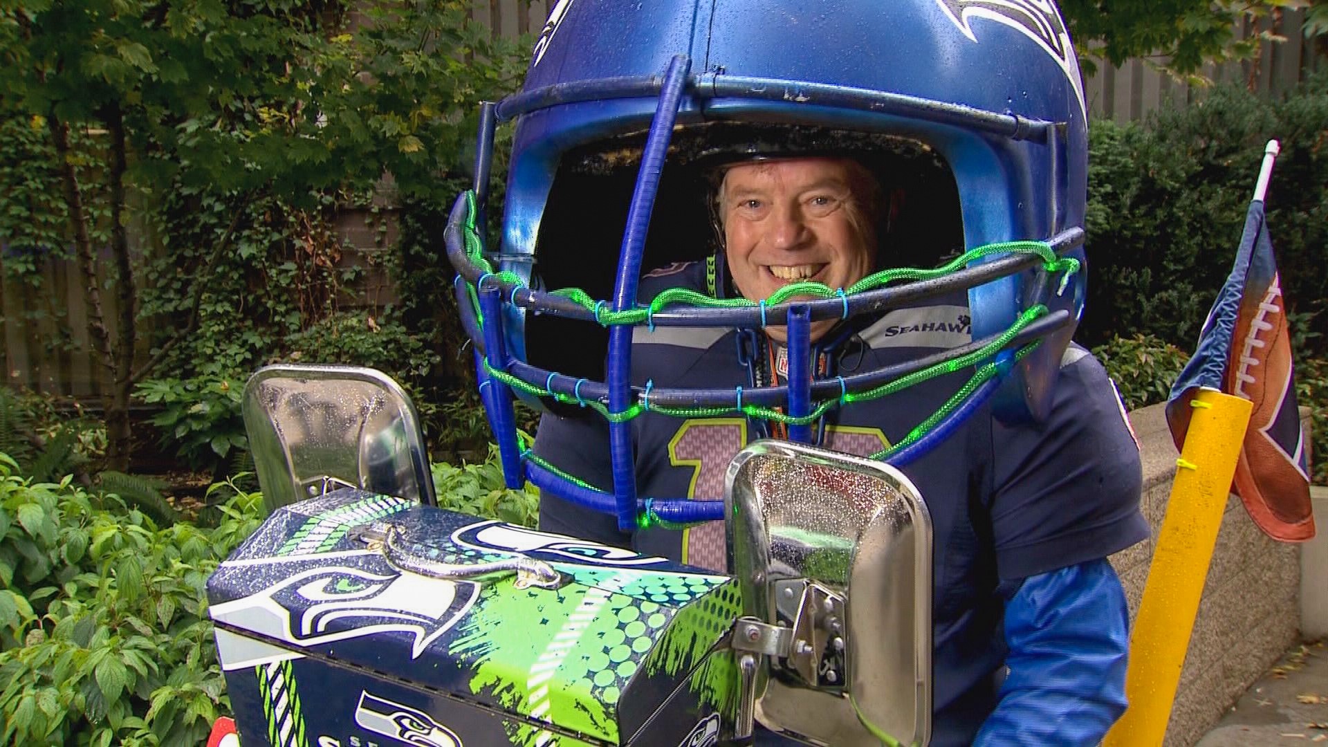 12's know Mike Melchior as the Helmet Guy -- riding a Hawks-clad bike in a massive football helmet
