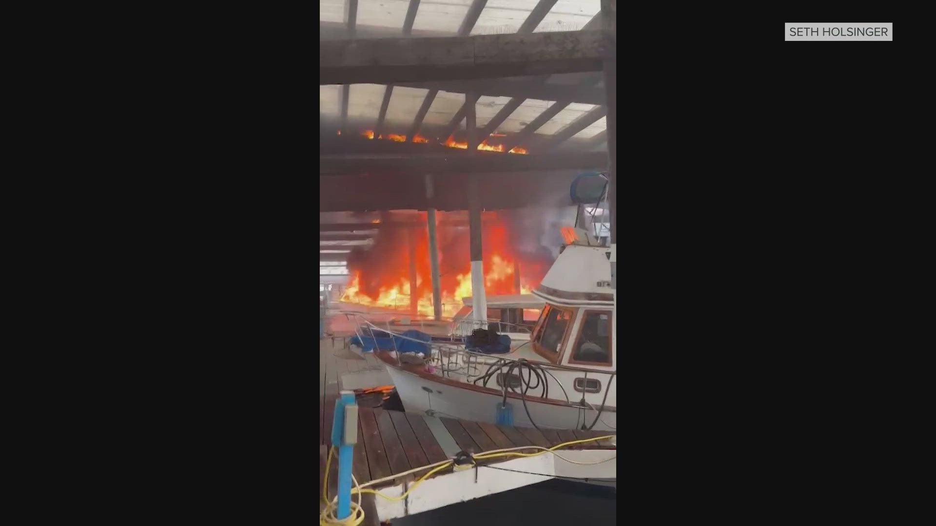 No one was injured when a boat caught fire, which spread to the dock and marina roof.