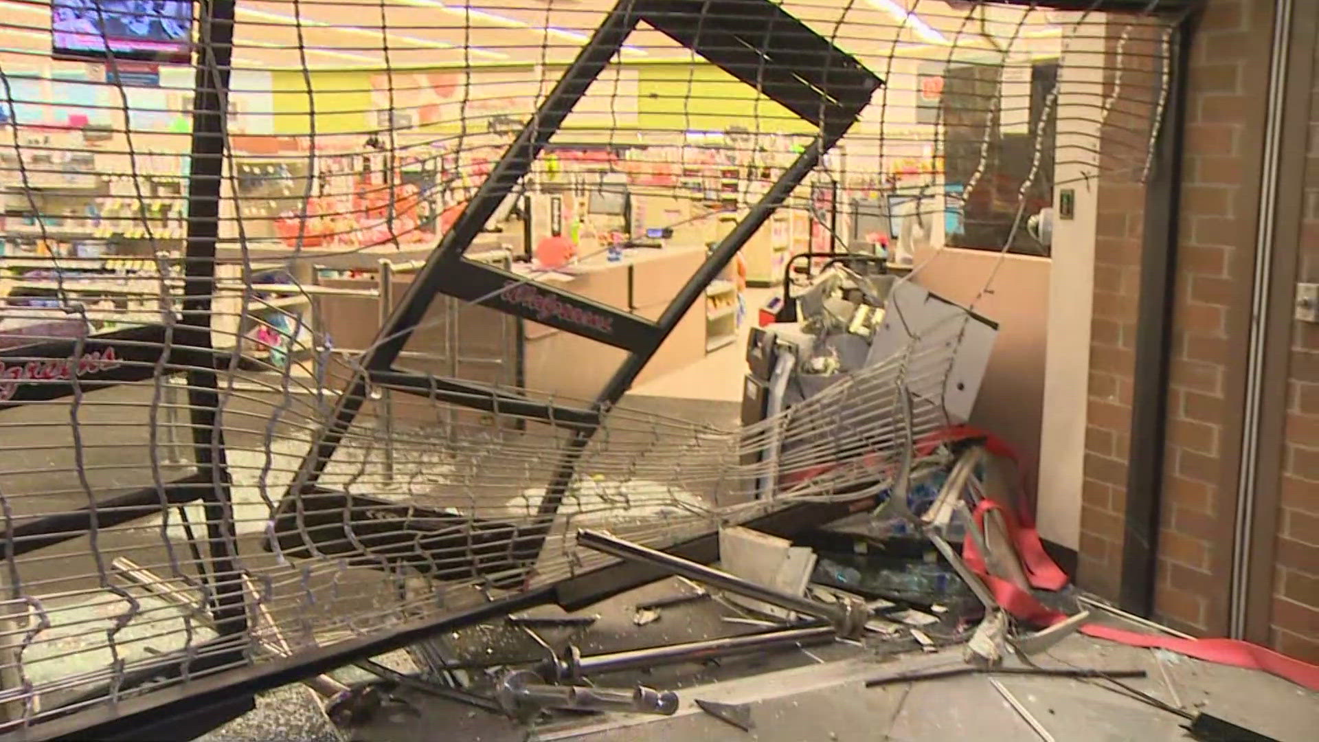 Surveillance footage shows a white truck repeatedly backing into a Walgreens in Seattle's Central District in an apparent attempt to steal the ATM