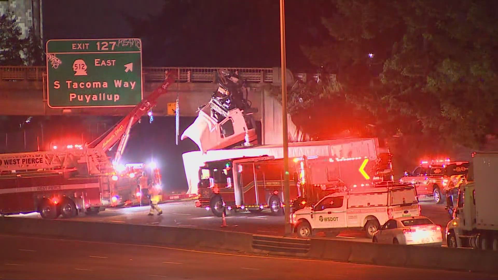 A semi truck going northbound on I-5 struck a jersey barrier and ended up on its side with the cab striking an overpass near exit 127 of I-5 N in Lakewood
