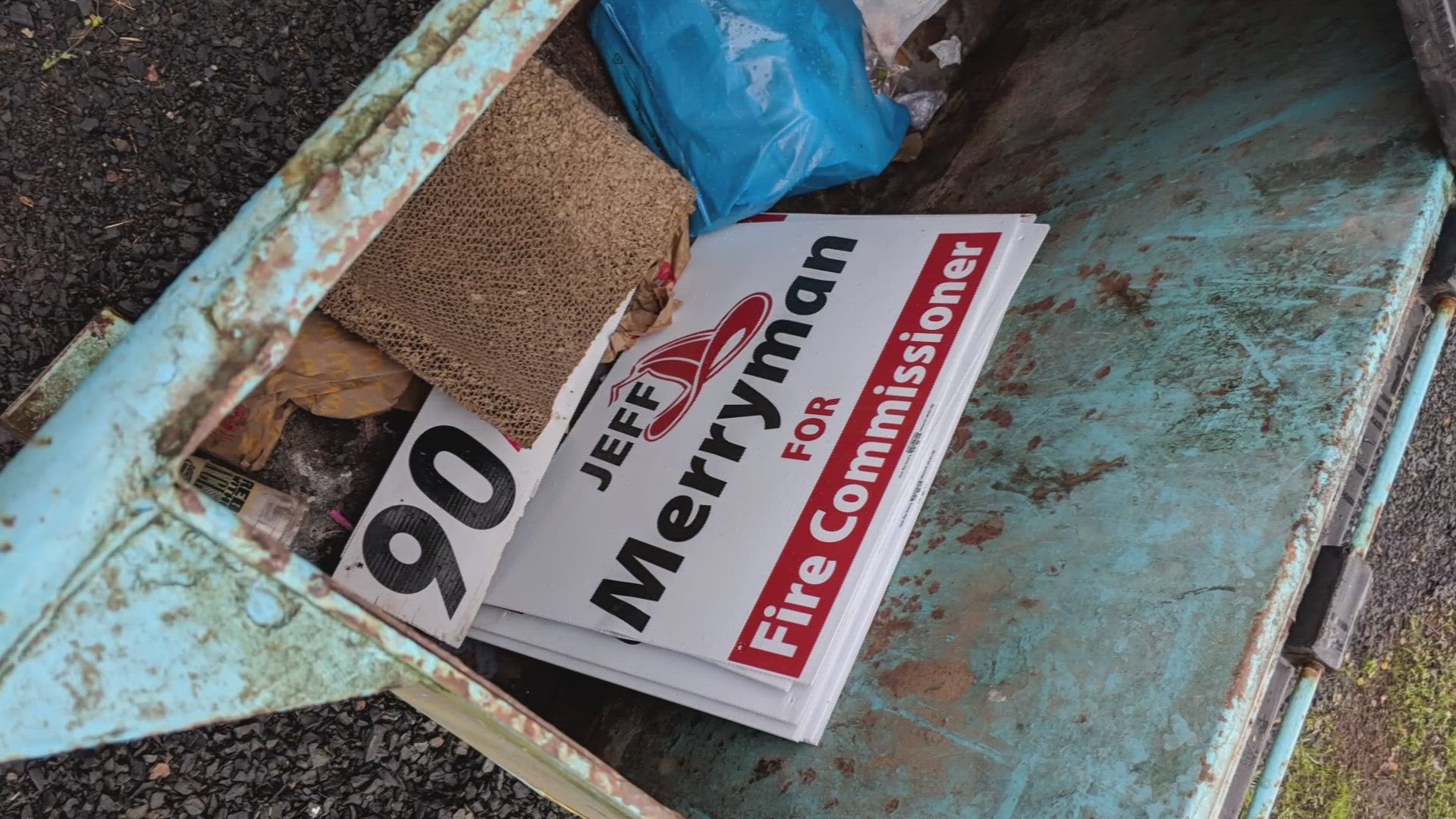 A fire commission candidate found his signs in a dumpster with help from an online tracking device.