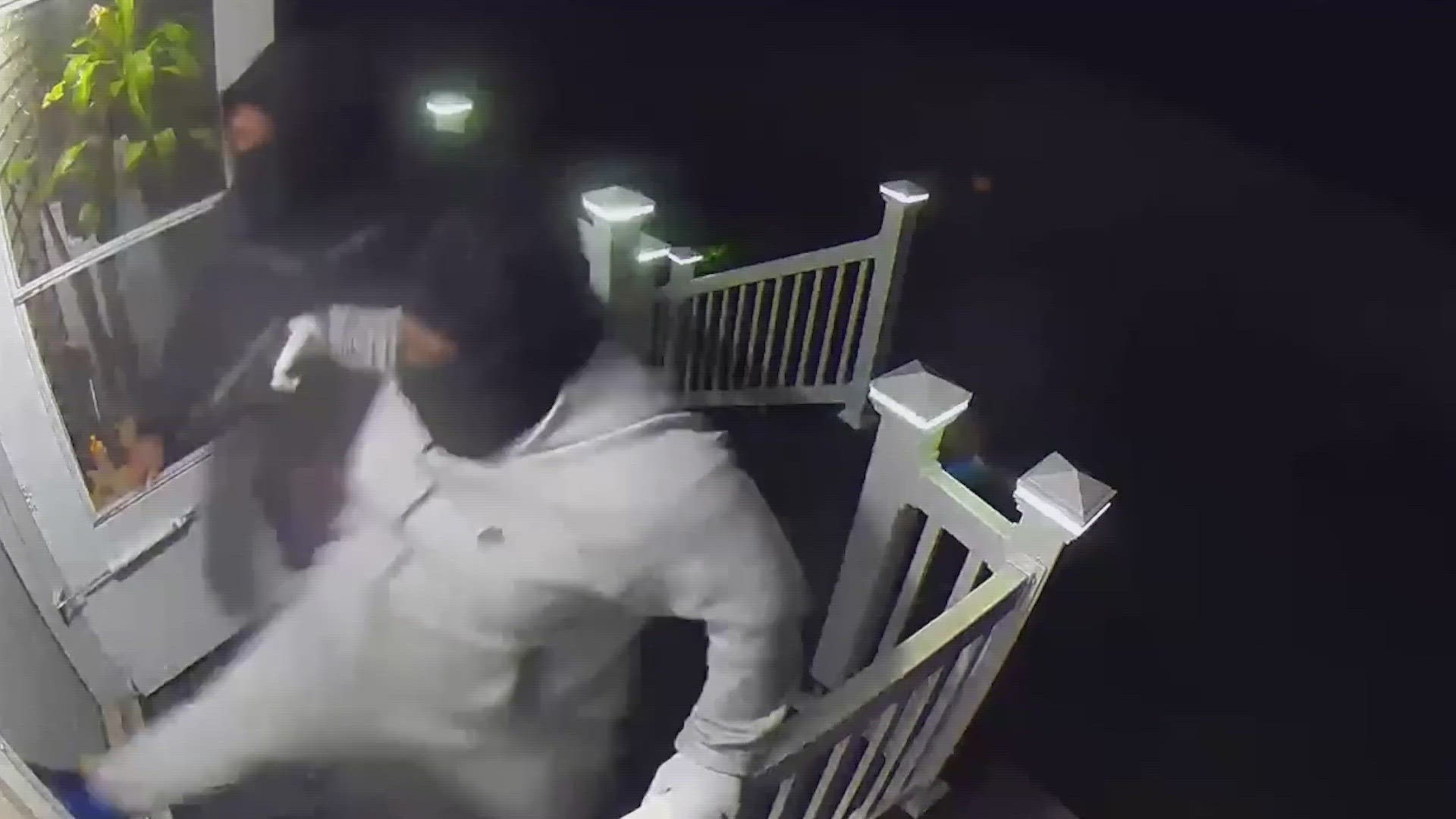 Security footage shows the suspects shouting "Seattle police" before attempting to kick in the front door.