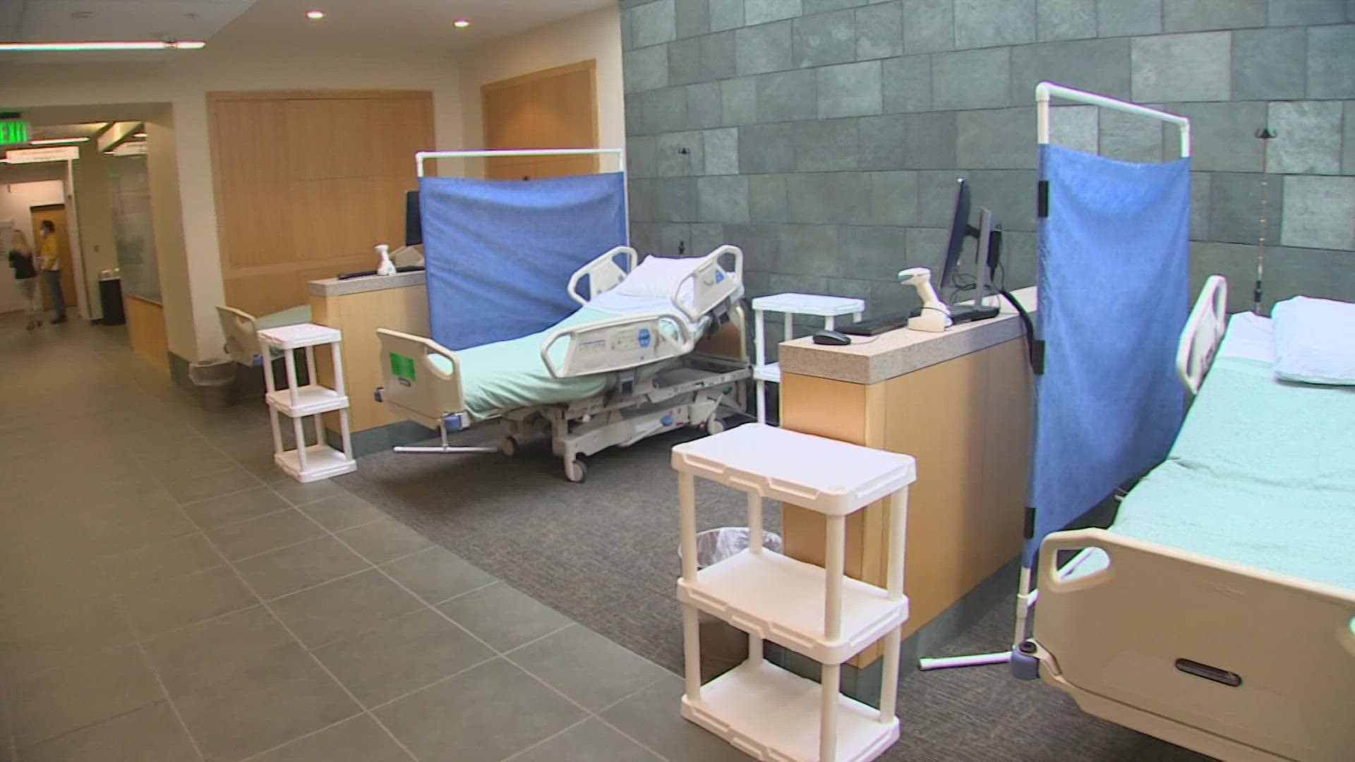 Providence St. Peter Hospital has set up hospital beds in rooms normally used for support groups and employee training to free up space for more COVID-19 patients.