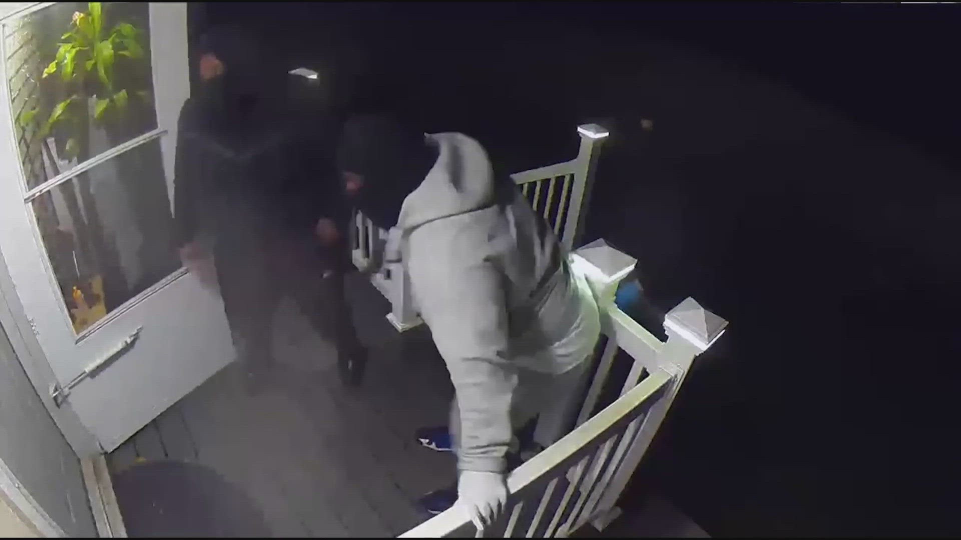 Security footage shows the suspects shouting "Seattle police" before attempting to kick in the front door