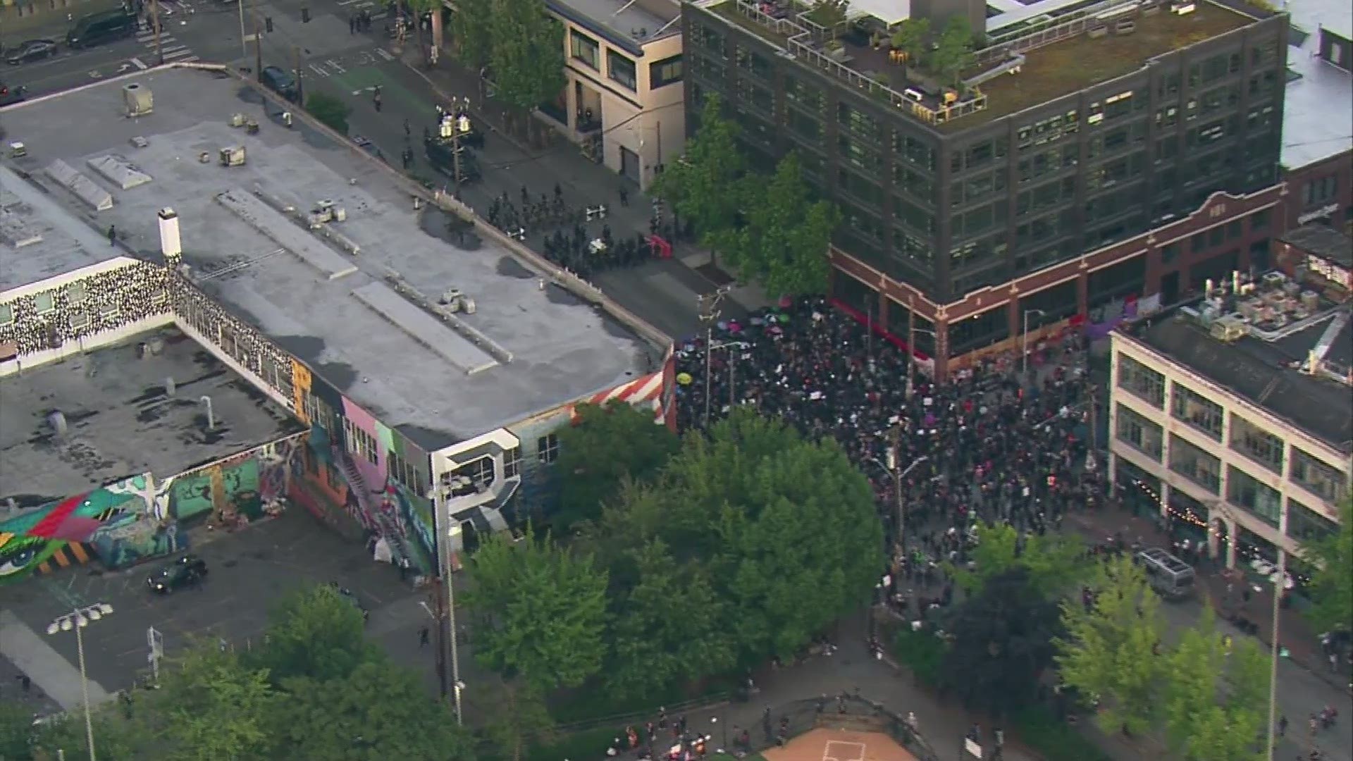 A man was shot after a car ran through a crowd during a protest in Seattle on June 7, 2020.