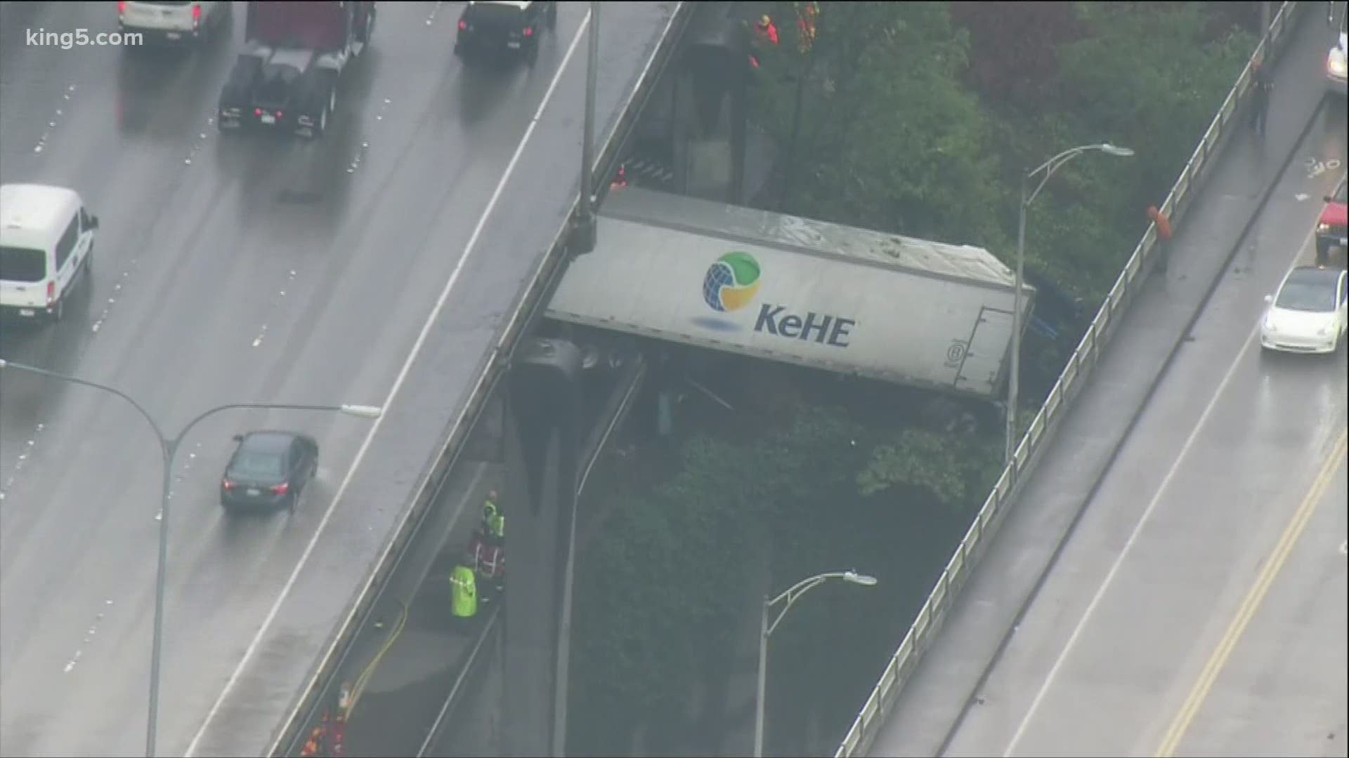 Semi-truck Hangs Over Barrier After Crashing On I-5 Express Lanes In ...