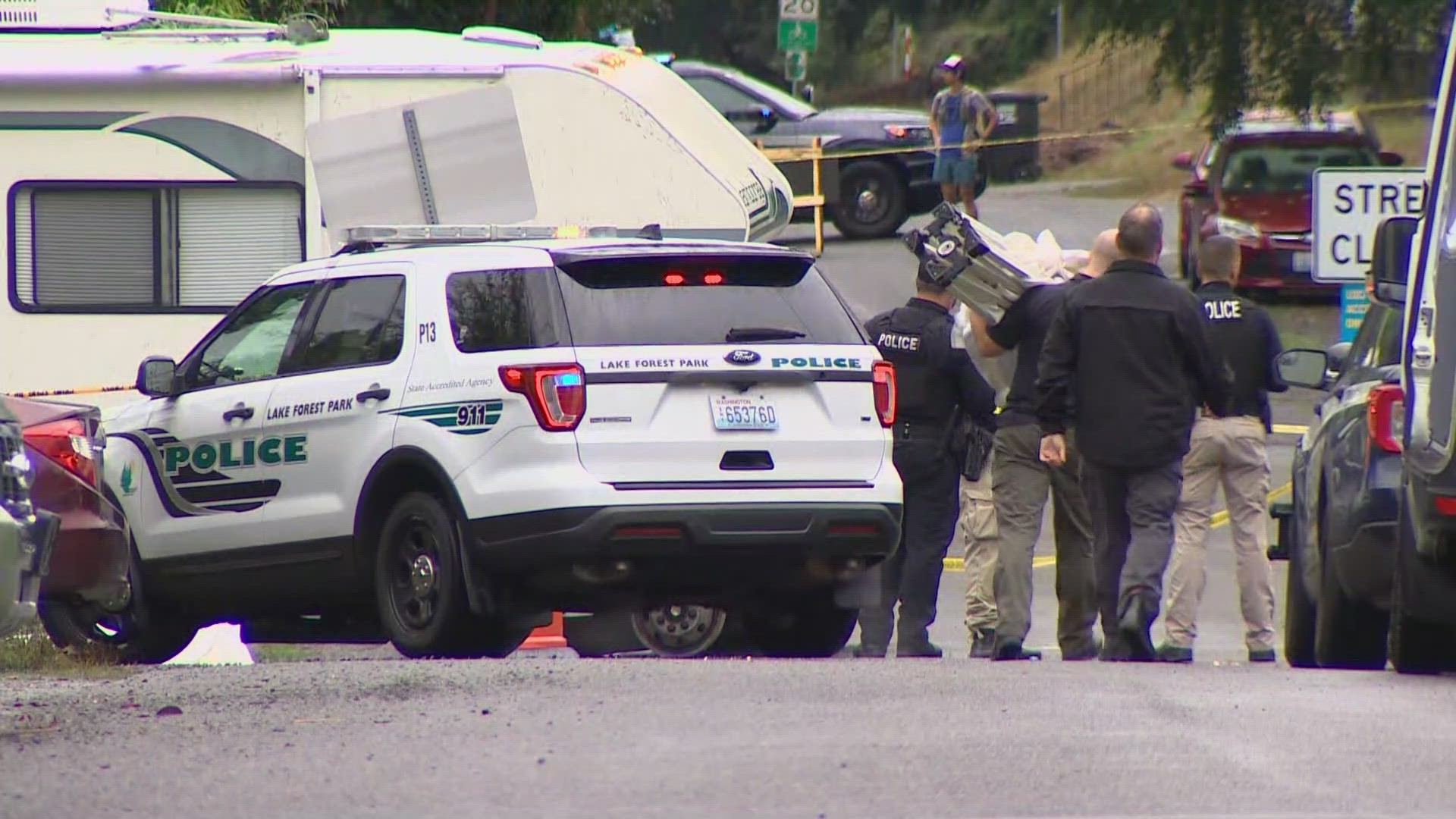 One person was found shot inside an RV in Seattle's Lake City neighborhood after police were led there from a collision in nearby Lake Forest Park