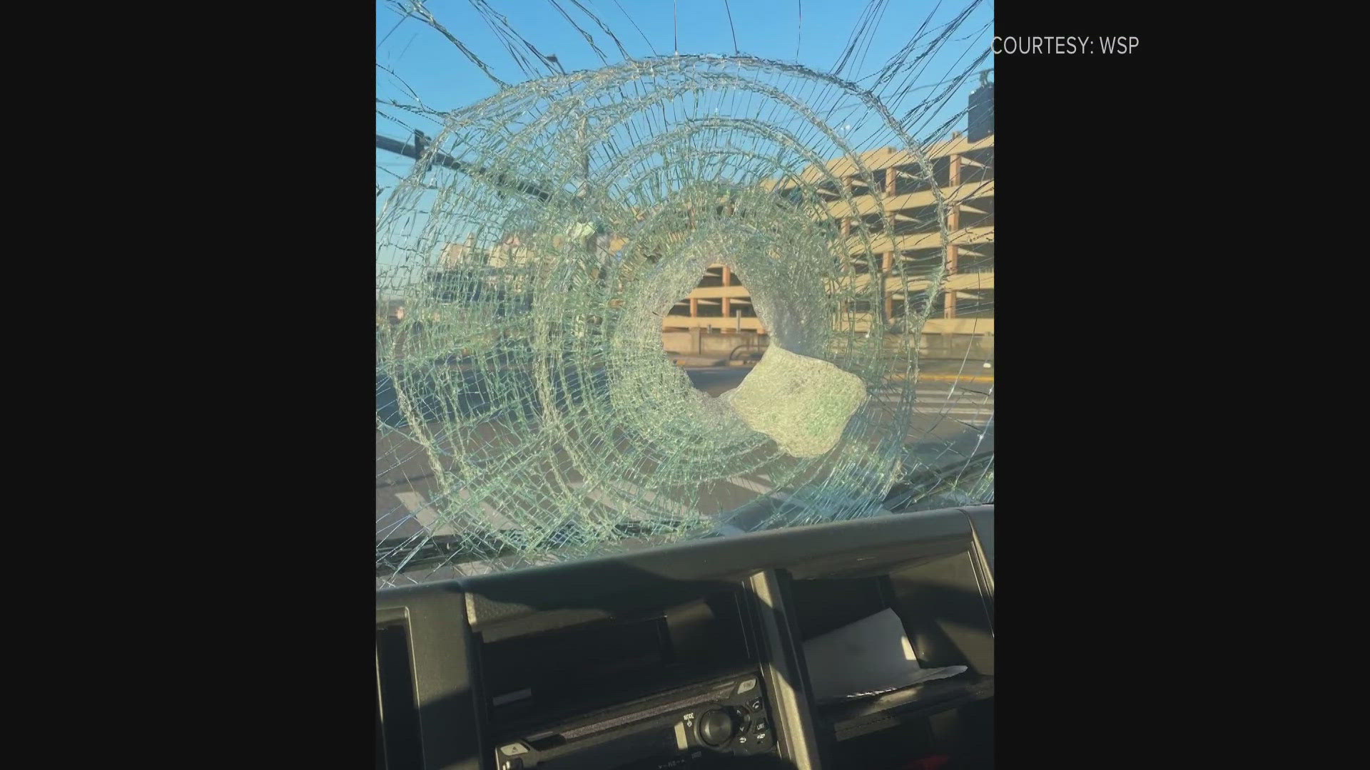 A driver was traveling on the interstate near Rainier Avenue when someone threw a brick through the windshield.
