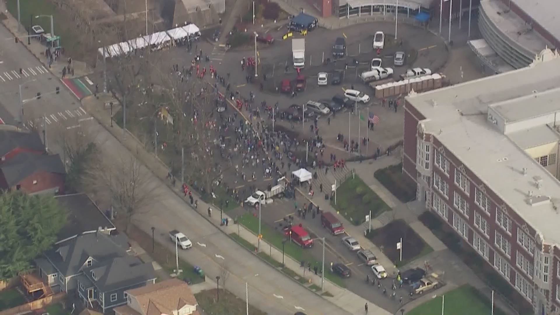A large group gathered outside Seattle's Garfield High School ahead of a peaceful march in honor or Dr. Martin Luther King Jr.