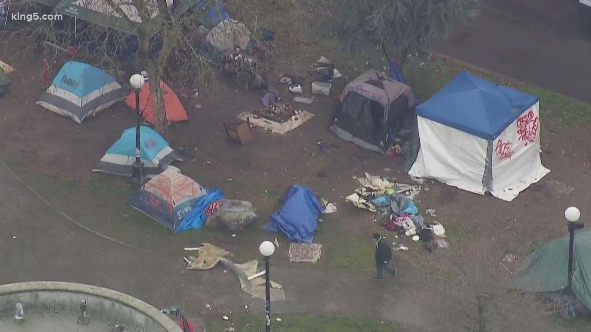 Seattle police began clearing a homeless camp in Cal Anderson Park Friday morning.