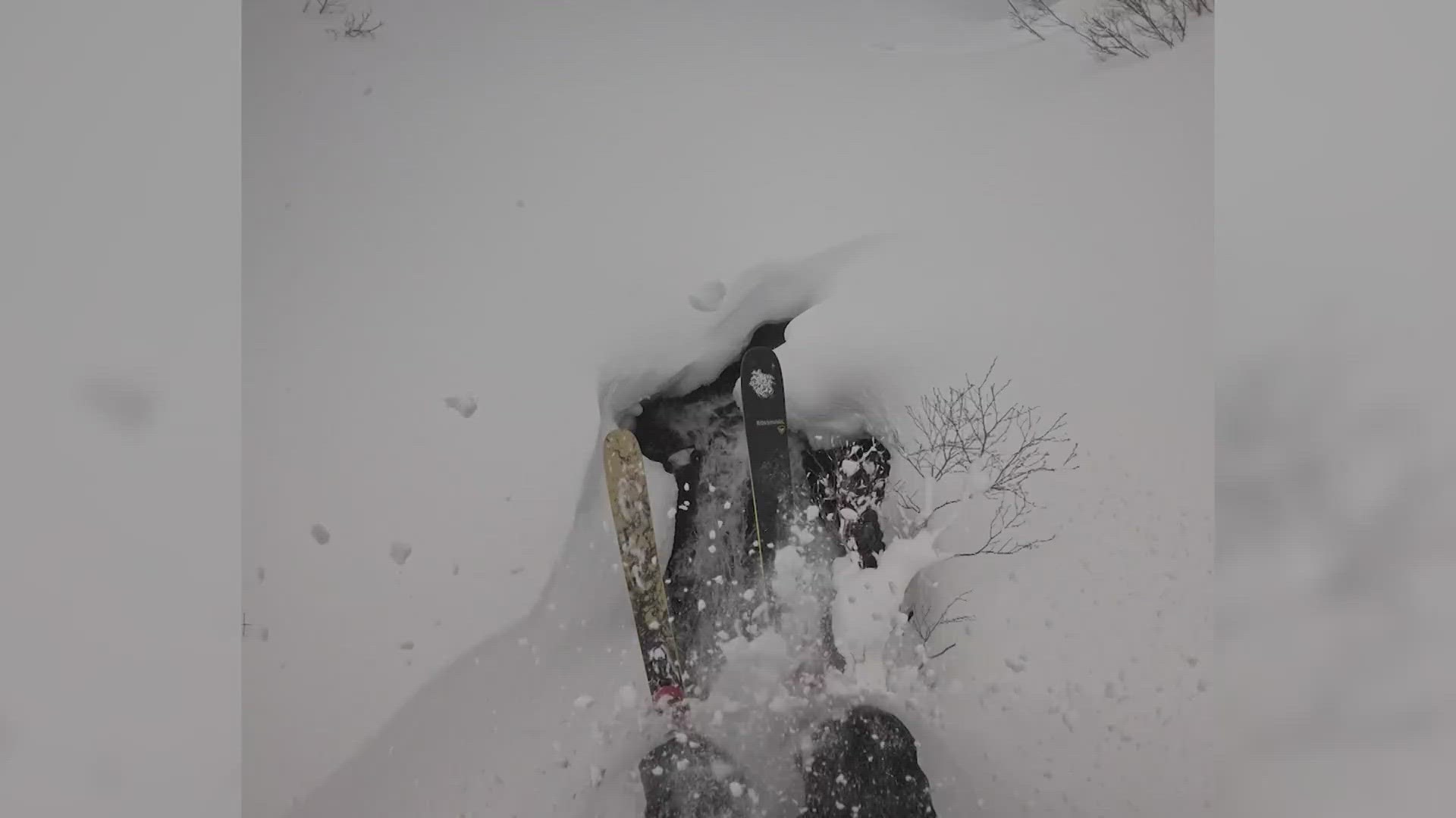 Skiier falls into hidden waterfall