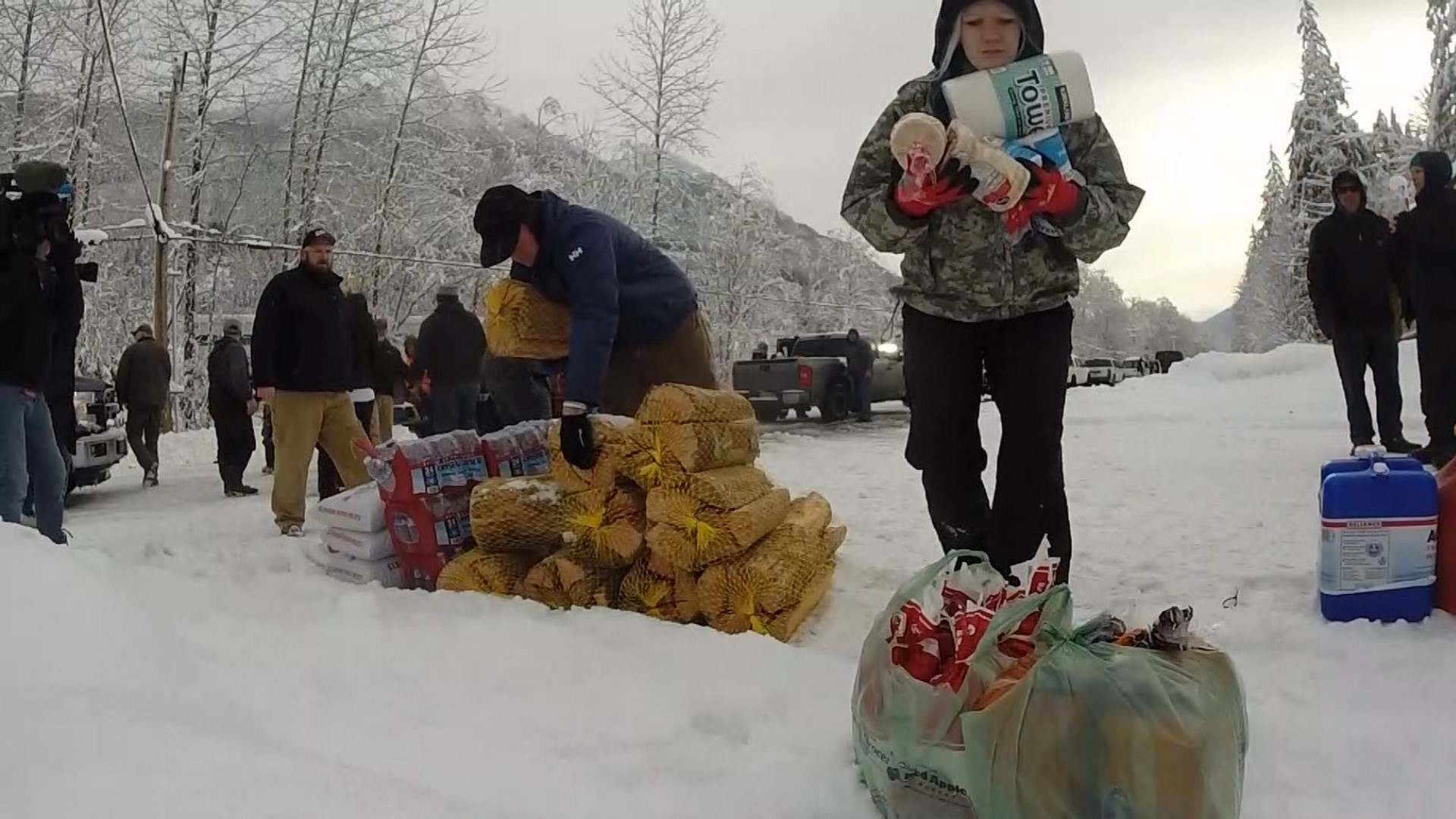 On Wednesday, Washington Department of Transportation escorted a group of volunteers across US 2 with supplies donated for residents who have been trapped by snow.