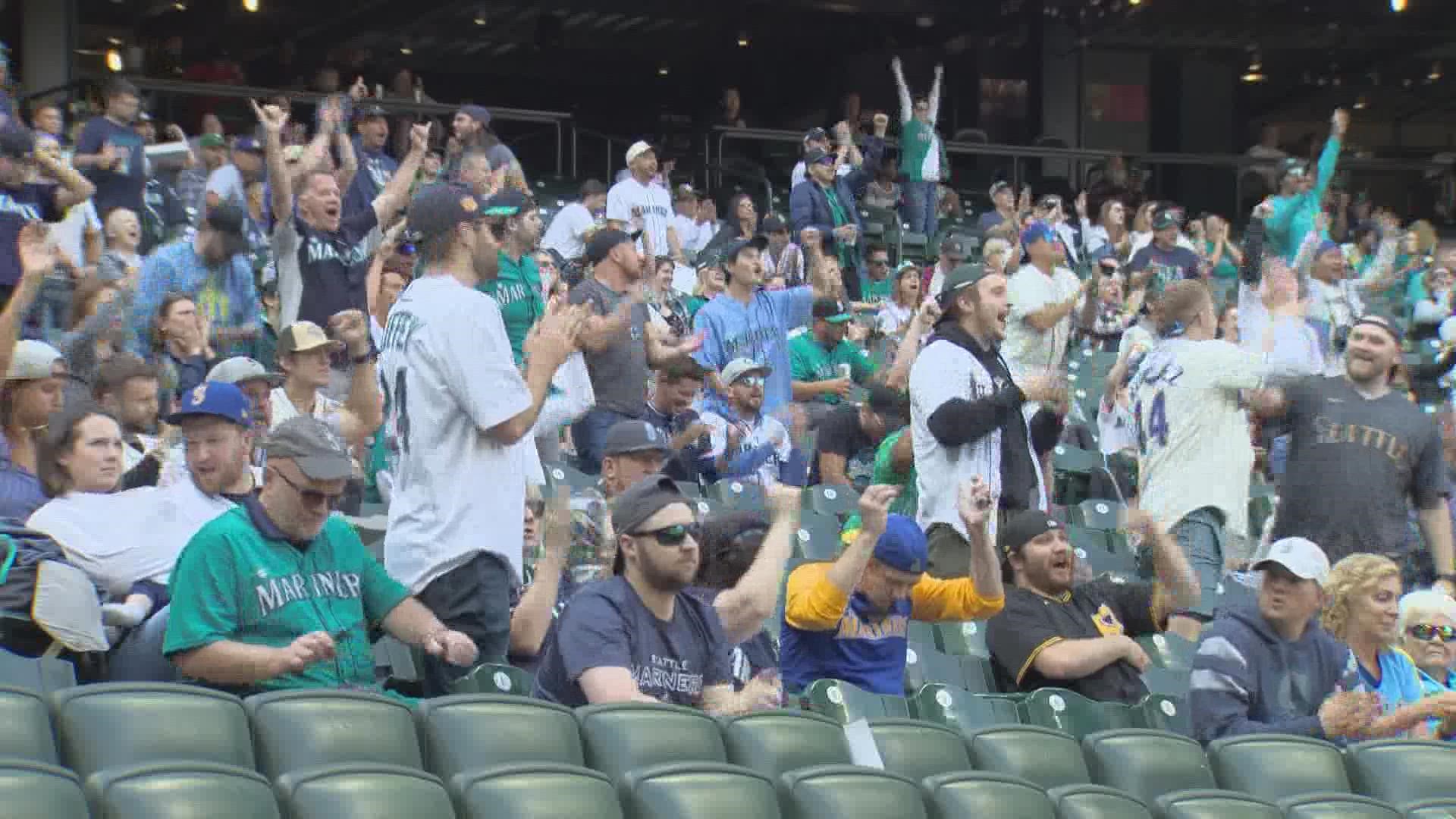 Fans watched and celebrated the team's win over the Blue Jays at T-Mobile Park on Oct. 7.